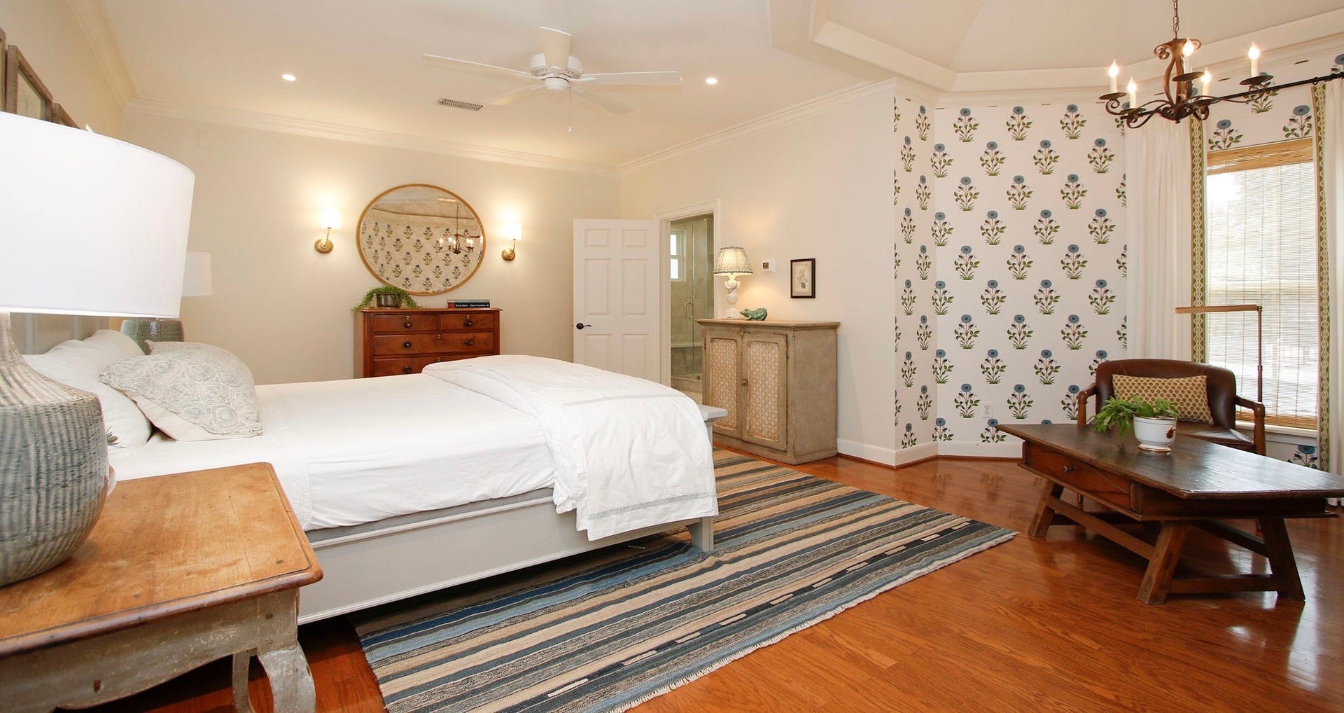 8515 Tranquil Park Drive, Spring, TX 77379 The primary bedroom offers privacy and features a stylish sitting area highlighted by designer wallpaper.