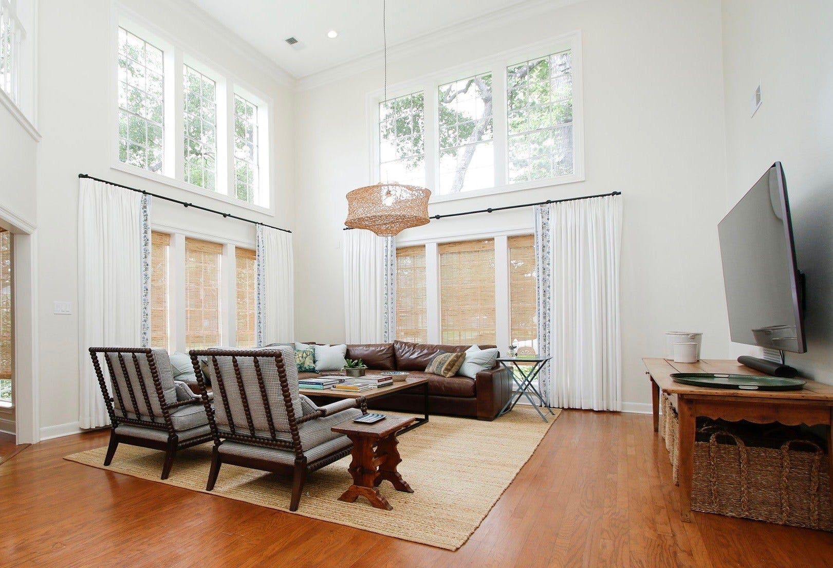 8515 Tranquil Park Drive, Spring, TX 77379 Two Story family room is just off the breakfast area and showcases the walls of windows.