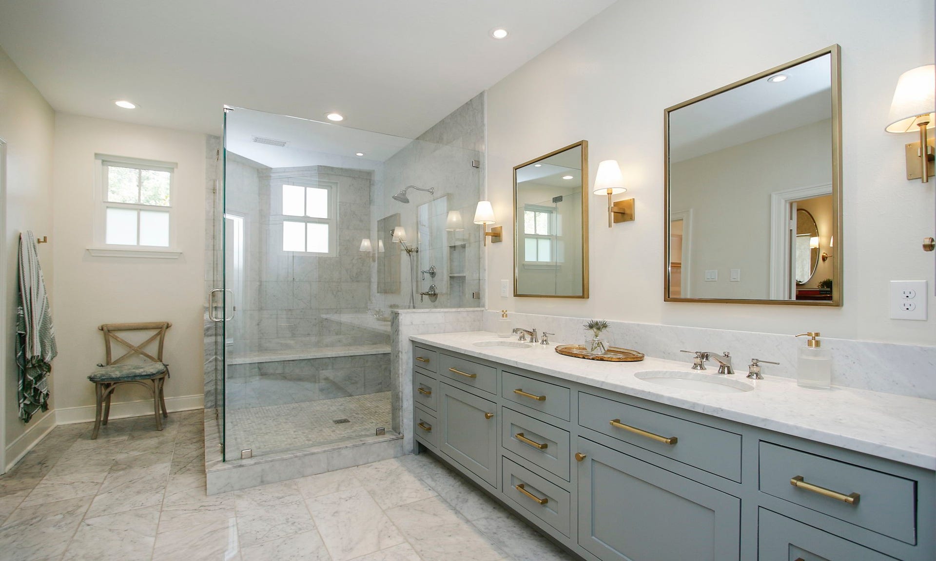 8515 Tranquil Park Drive, Spring, TX 77379 The primary bathroom was totally remodeled with a large walk in shower. The walk in closet is to the left of the chair.