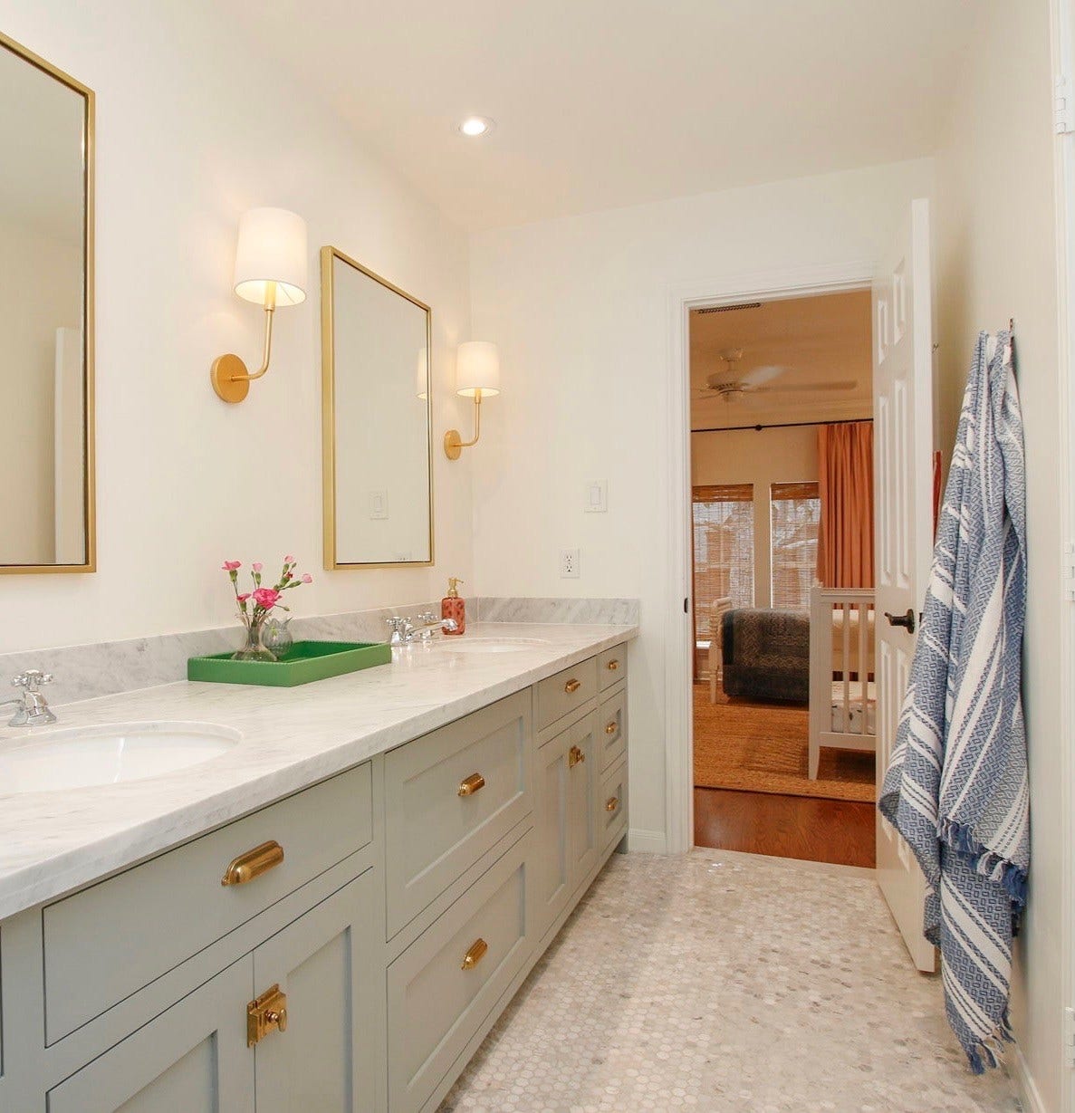 8515 Tranquil Park Drive, Spring, TX 77379 This remodeled bathroom connects two of the second floor bedrooms. As with all other bathrooms, this bathroom has new cabinetry and glowing Carrara marbla.