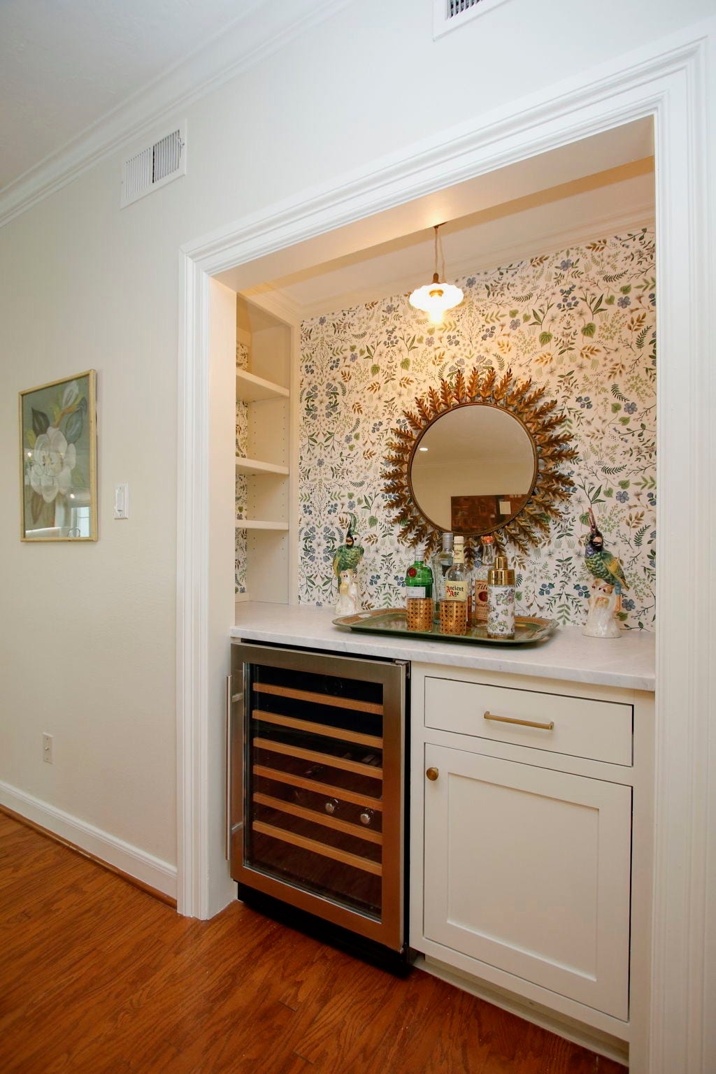 8515 Tranquil Park Drive, Spring, TX 77379 Luxurious wet bar with Carrara marble countertop and built-in beverage fridge.