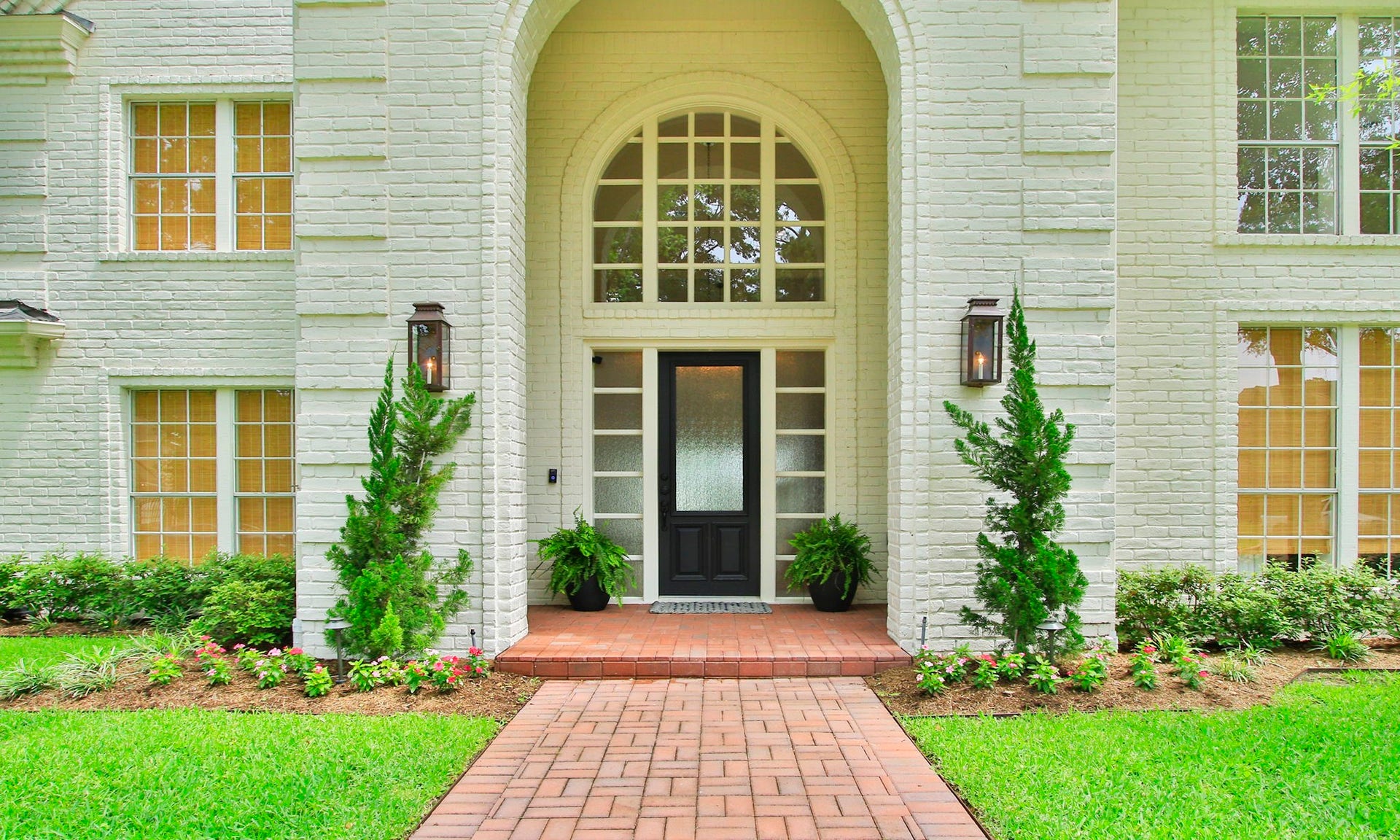 8515 Tranquil Park Drive, Spring, TX 77379 Soaring entry with solid wood door, side lights and arched window.