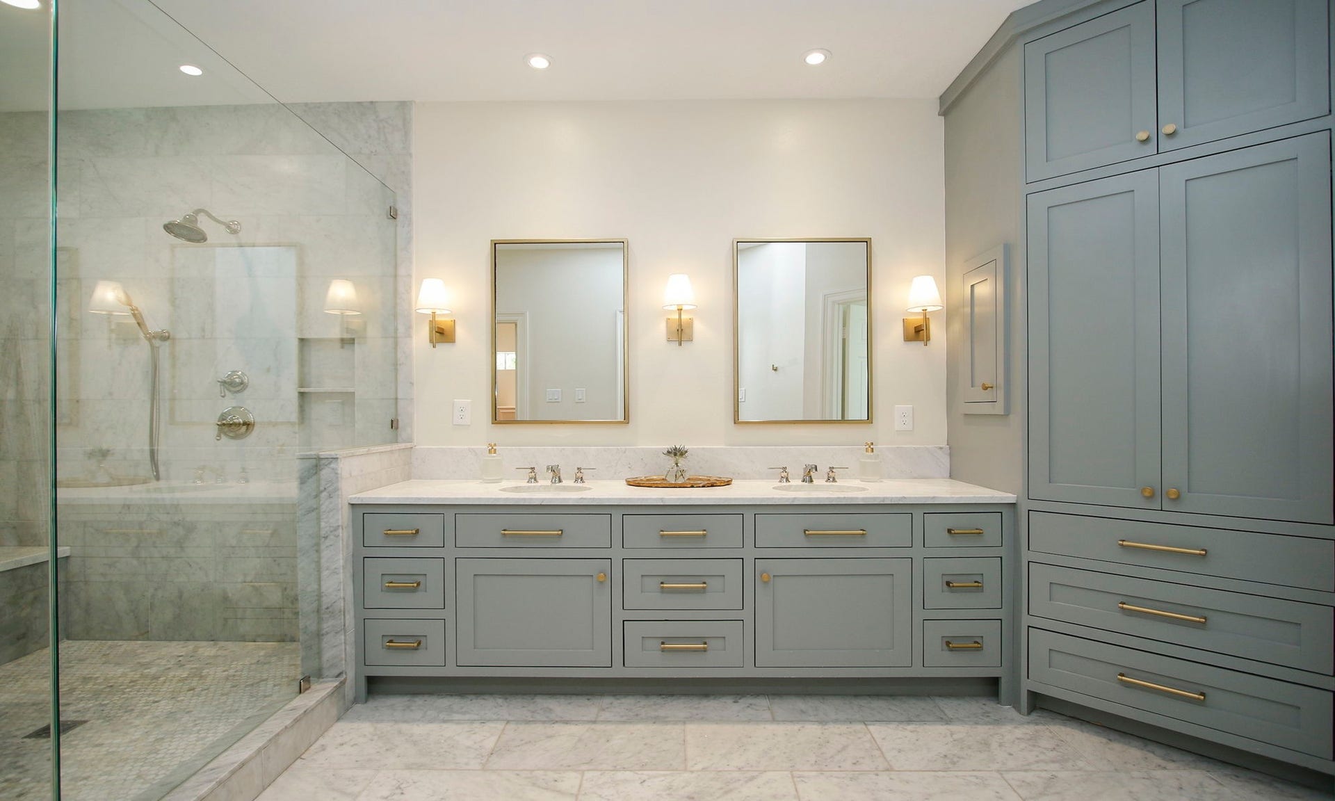 8515 Tranquil Park Drive, Spring, TX 77379 This jaw dropping remodeled primary bathroom features new cabinetry, Carrara marble counter, floors and shower.