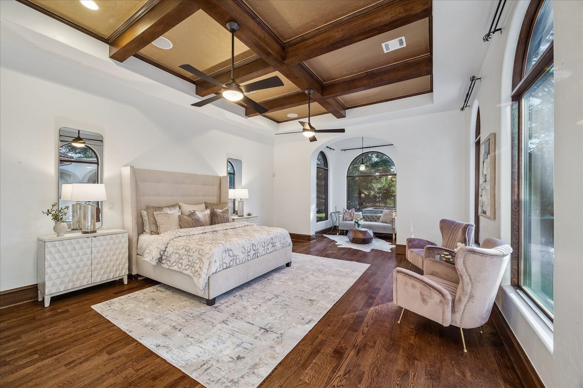 6 N Fazio Way, Spring, TX 77389 Primary bedroom with sitting area overlooking backyard oasis.