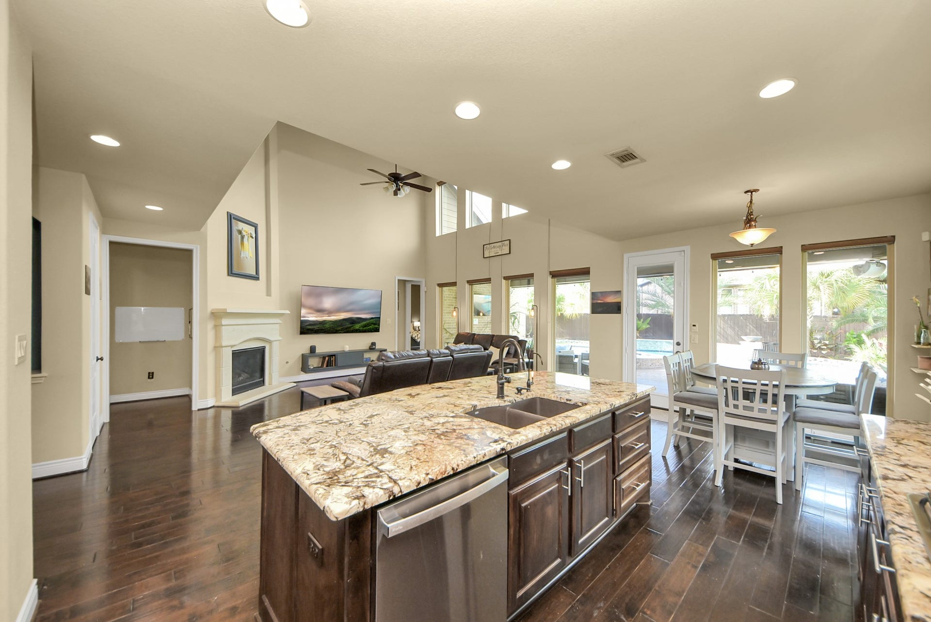 9723 Painted Stone Court, Cypress, TX 77433 Spacious kitchen flows seamlessly into the inviting family room and bright breakfast area.
