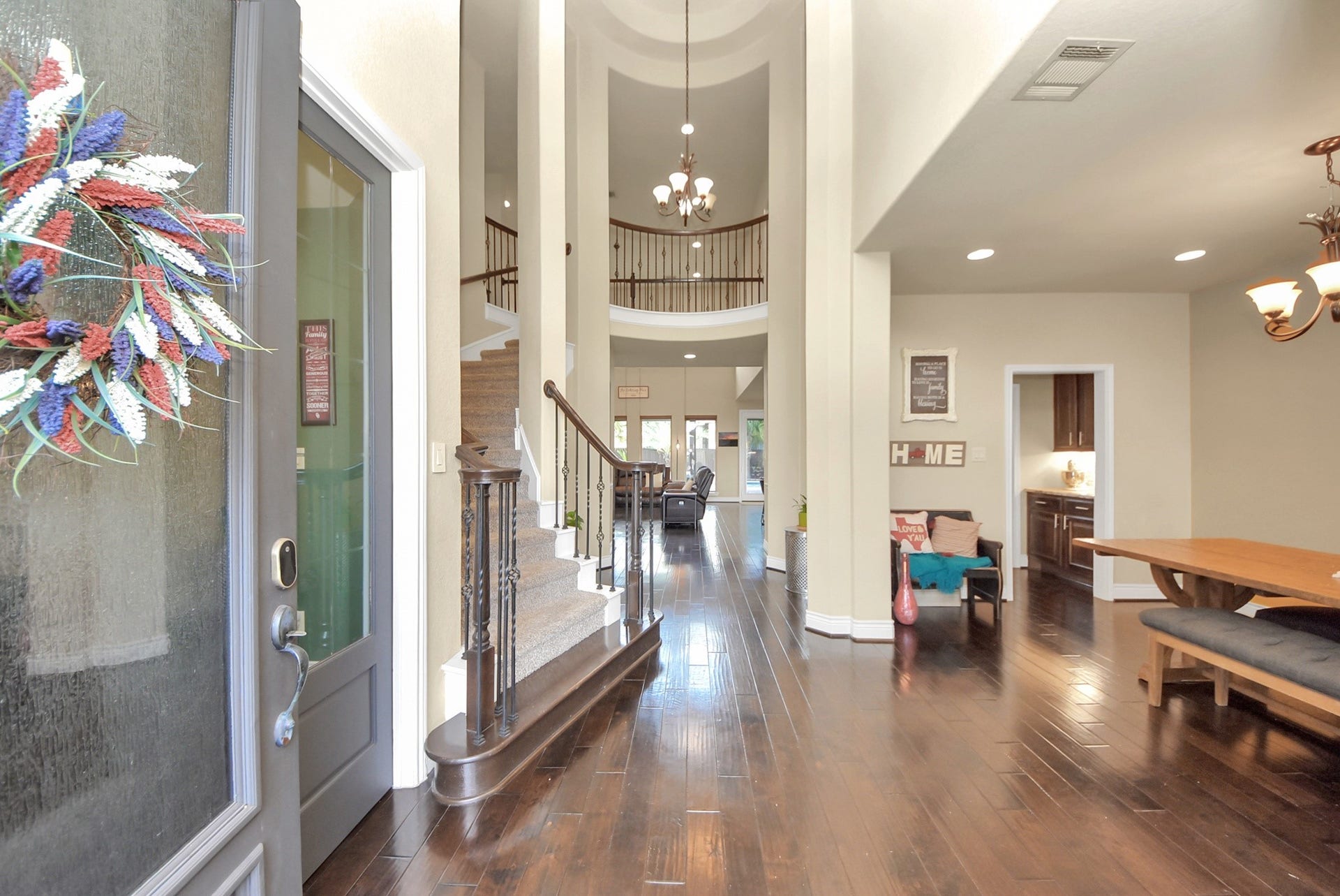 9723 Painted Stone Court, Cypress, TX 77433 Step into elegance with soaring ceilings in the main entrance, featuring a dramatic circular staircase and rotunda ceiling, leading seamlessly to the formal dining room and study.