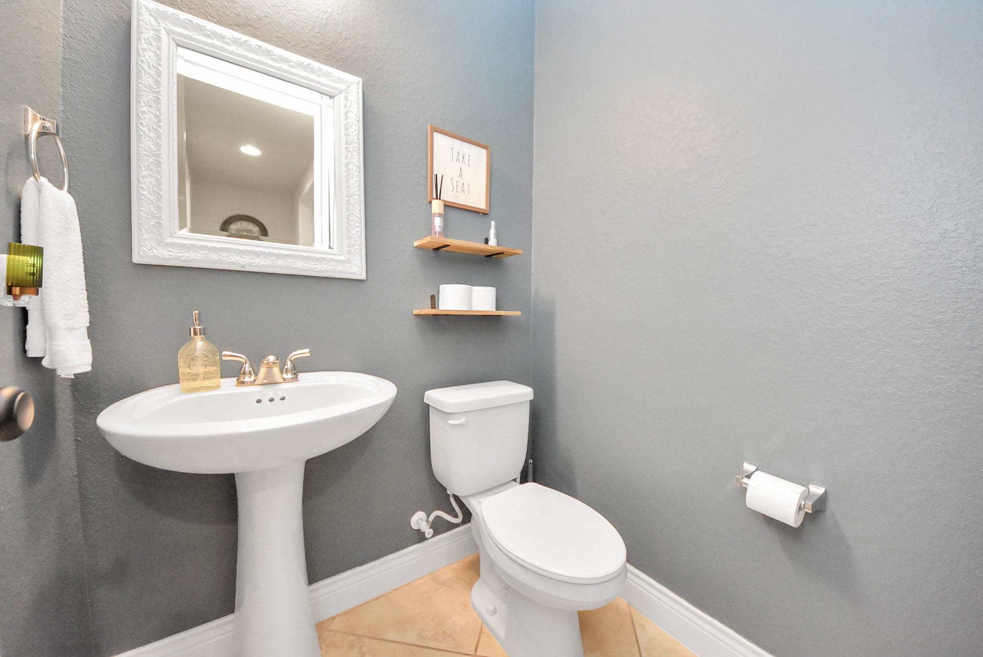 9723 Painted Stone Court, Cypress, TX 77433 Convenient first-floor half bath for your guests.