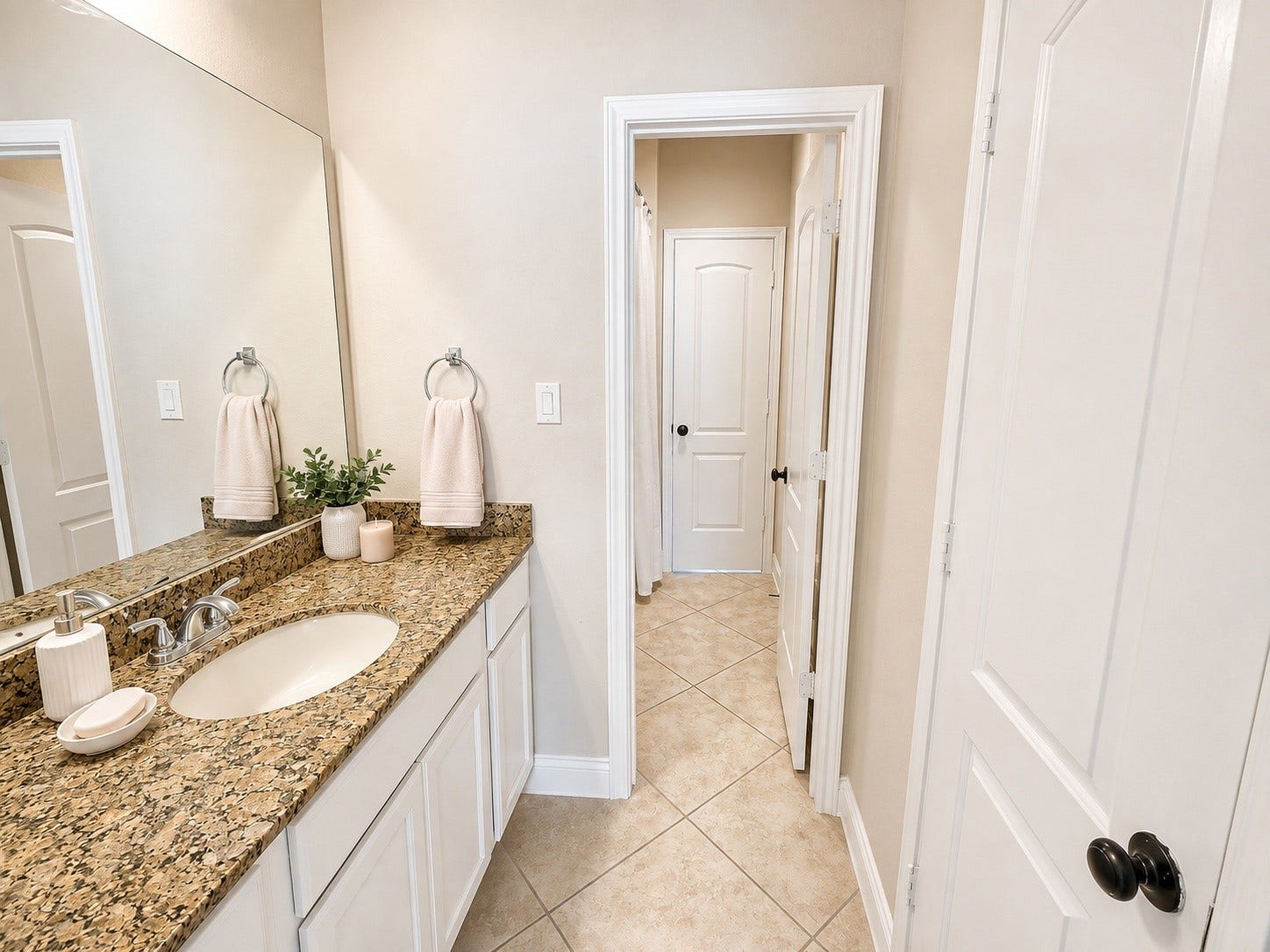9723 Painted Stone Court, Cypress, TX 77433 Jack and Jill bathroom connects bedrooms 3 and 4, featuring a separate vanity area for simultaneous use.