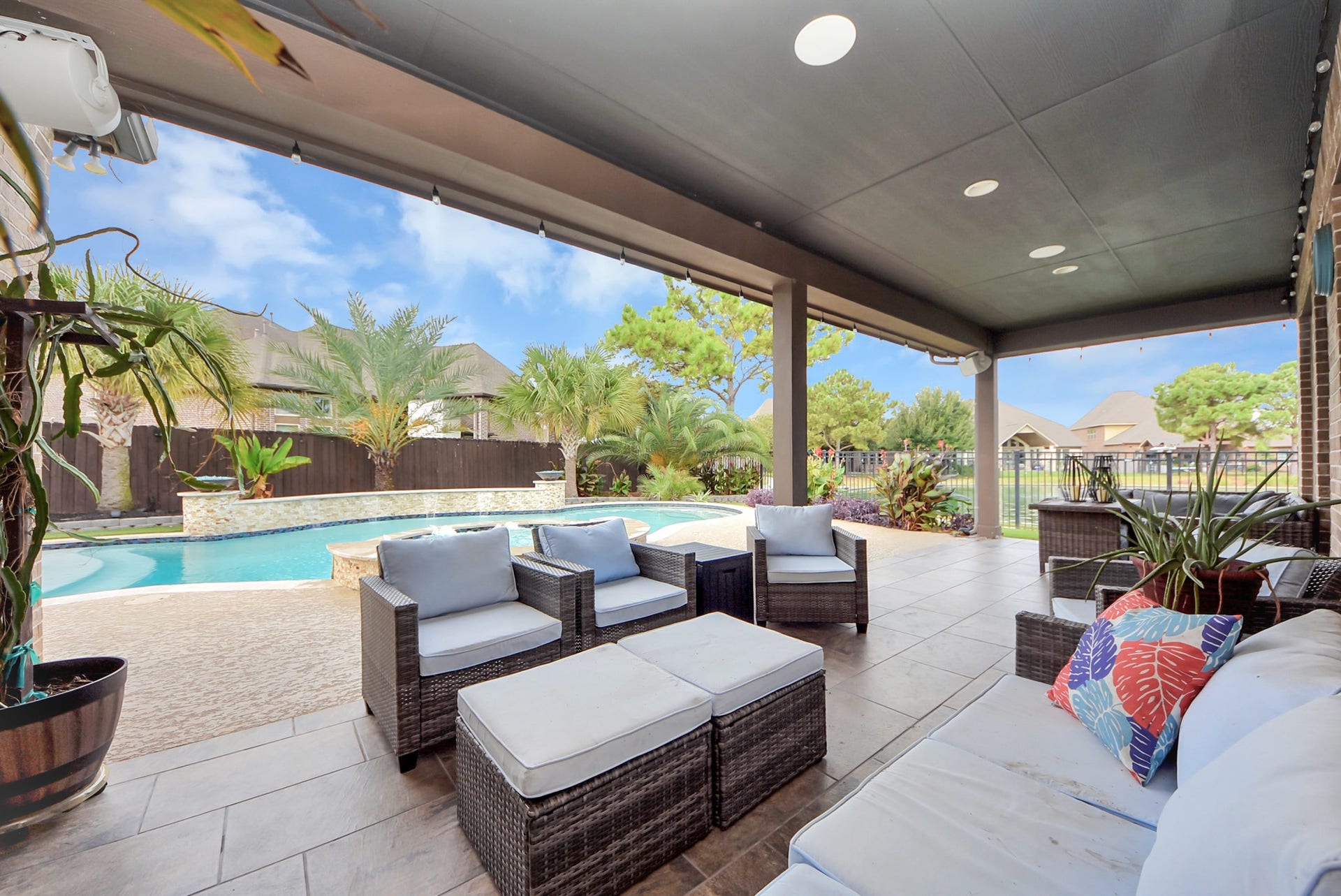 9723 Painted Stone Court, Cypress, TX 77433 Spacious covered patio with smart lighting for perfect ambiance.
