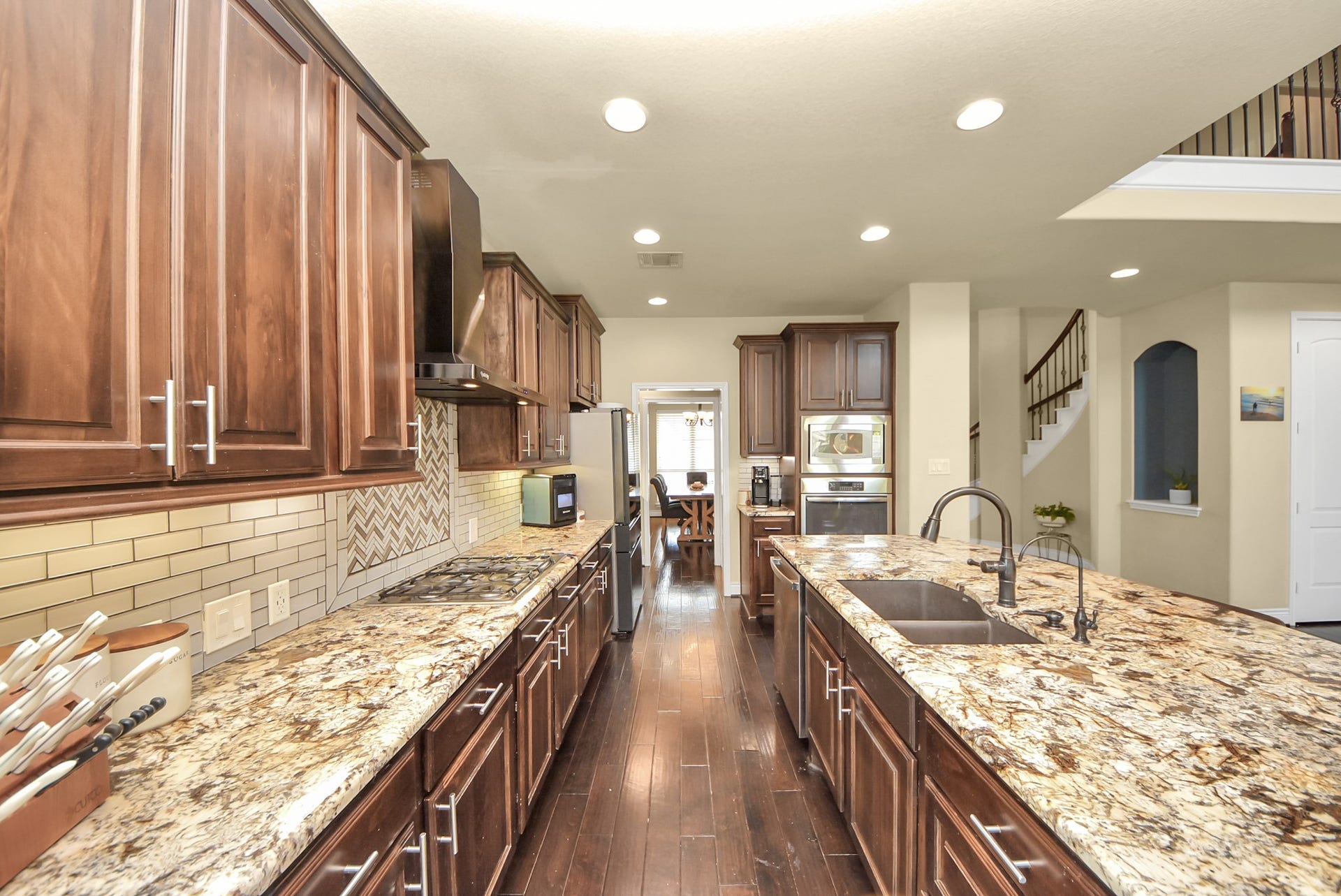 9723 Painted Stone Court, Cypress, TX 77433 Expansive countertops and ample under-cabinet storage provide both functionality and style.