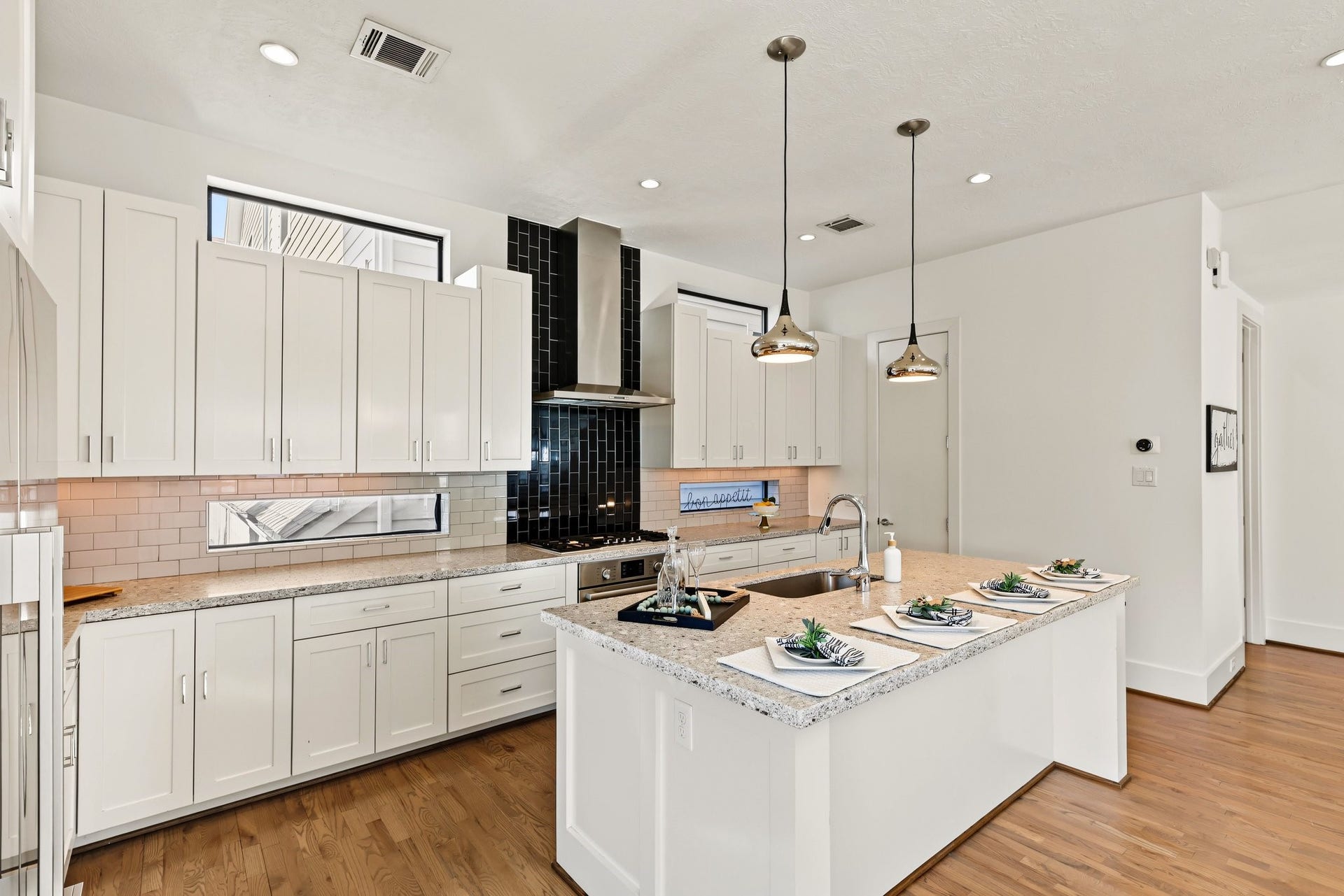 From quiet morning espresso at the breakfast bar to celebratory dinners with friends, this kitchen makes gathering feel second nature. Expansive quartz countertops and a flowing, open layout provide all the space you need to prep, serve, and stay effortlessly connected with guests.