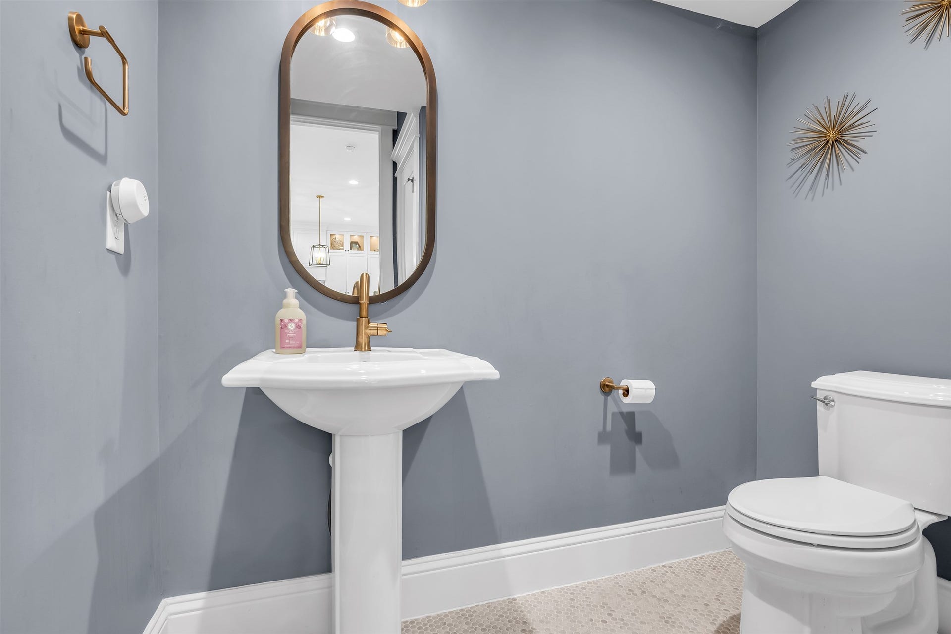 800 Walton Street, Houston, TX 77009 First-floor half bath features modern finishes, combining style and functionality for guests and everyday use.