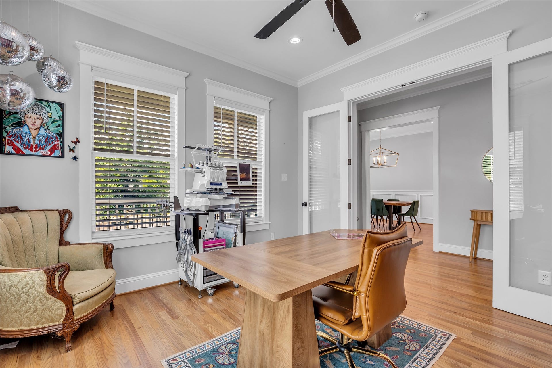800 Walton Street, Houston, TX 77009 From the home office, you can see a glimpse of the formal dining room and the foyer that connects the two spaces, highlighting the open flow of the layout.