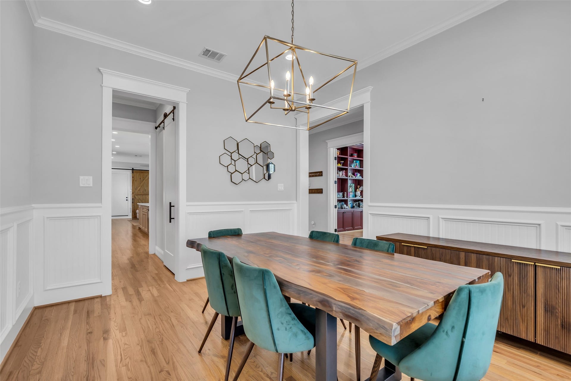 800 Walton Street, Houston, TX 77009 This view of the formal dining room highlights the doors that lead to the kitchen and other areas of the home, creating an open and accessible flow between spaces.