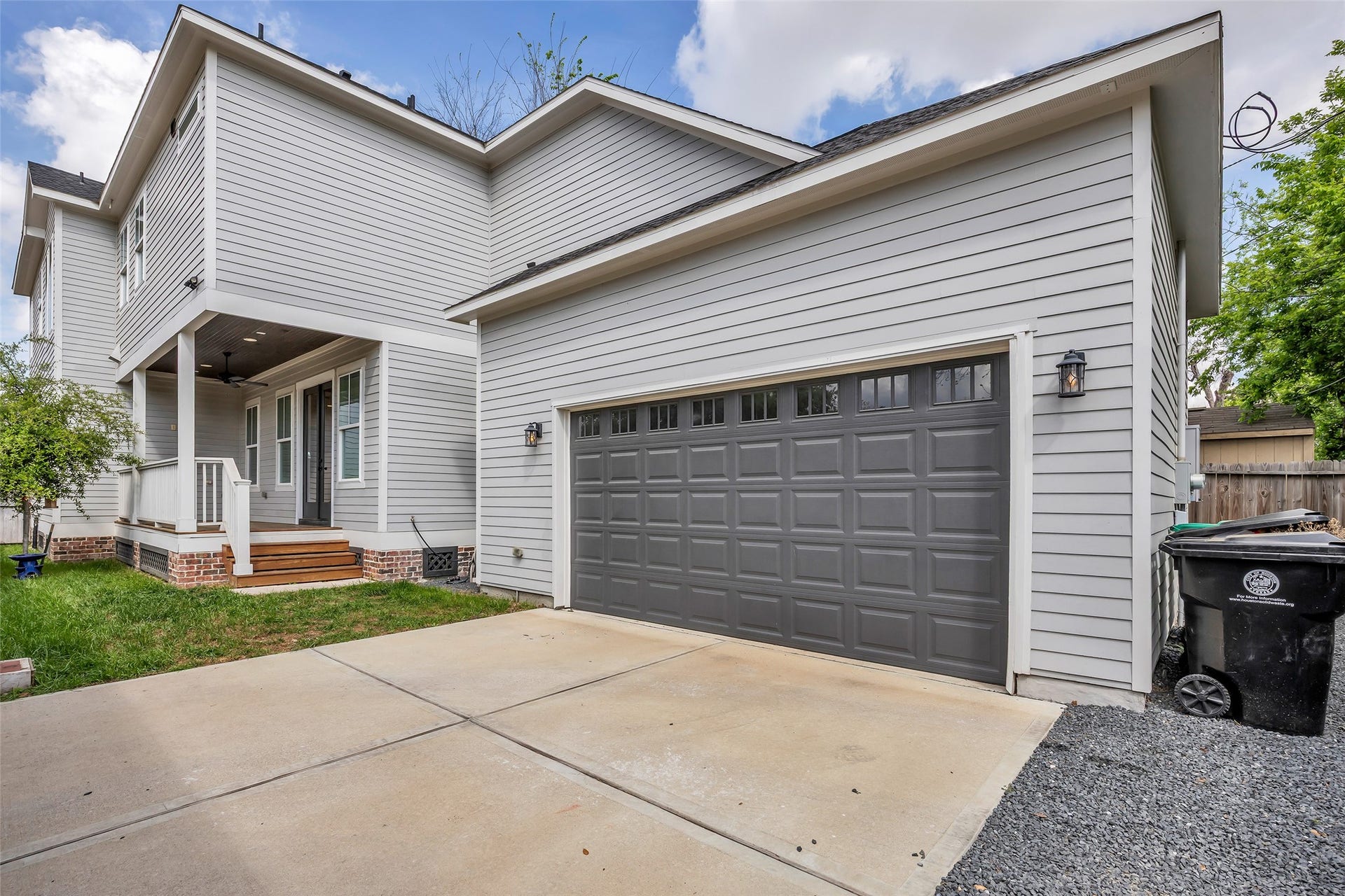 800 Walton Street, Houston, TX 77009 At the back of the house, youll find a private driveway along with an attached garage, providing convenient parking and easy access to the home.
