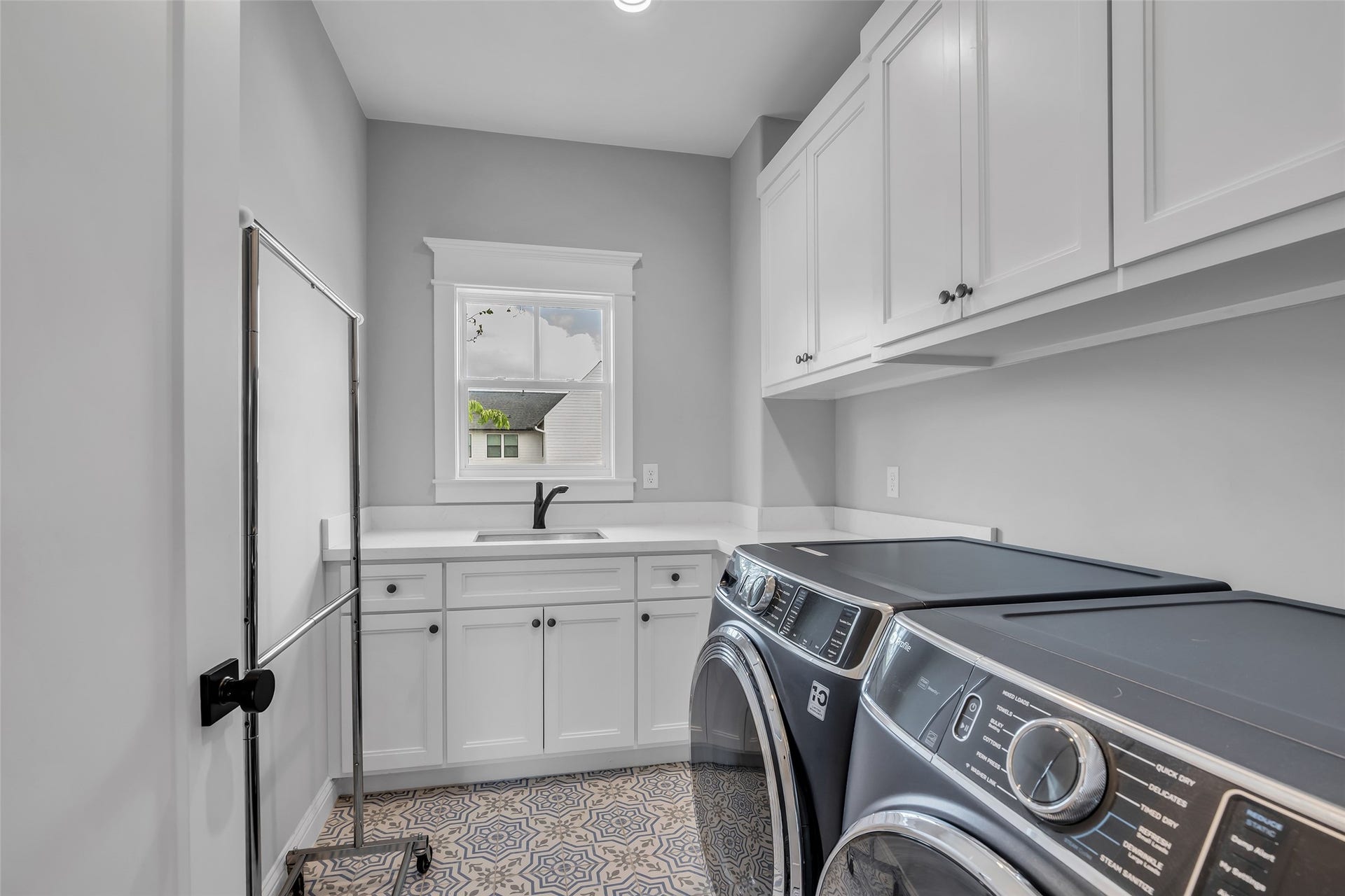 800 Walton Street, Houston, TX 77009 The laundry room includes electric and gas dryer connections, washer hookups, and plenty of storage space for added convenience.