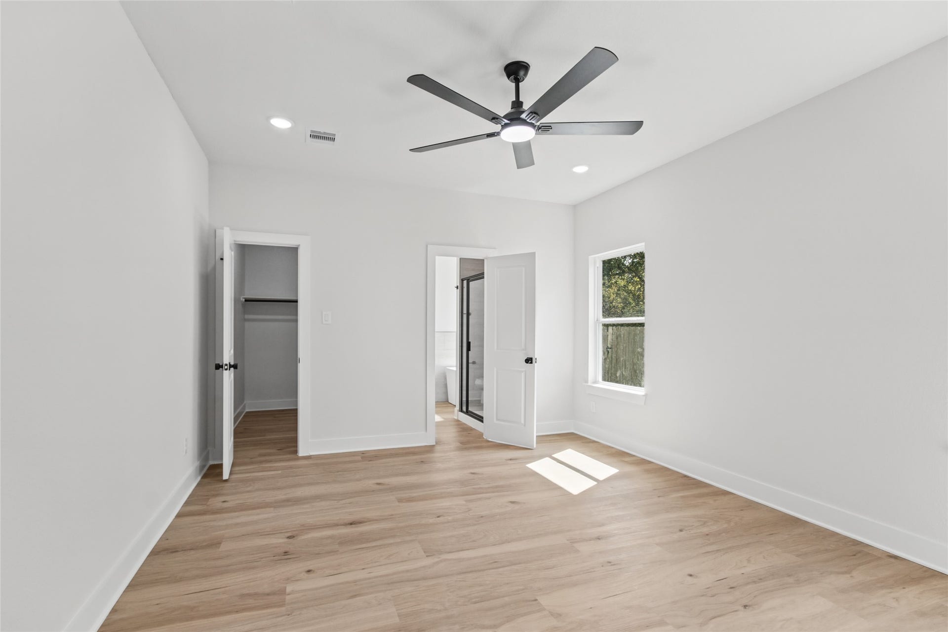 12025 21st Street, Santa Fe, TX 77510 Primary Bedroom with walk-in closet and bathroom