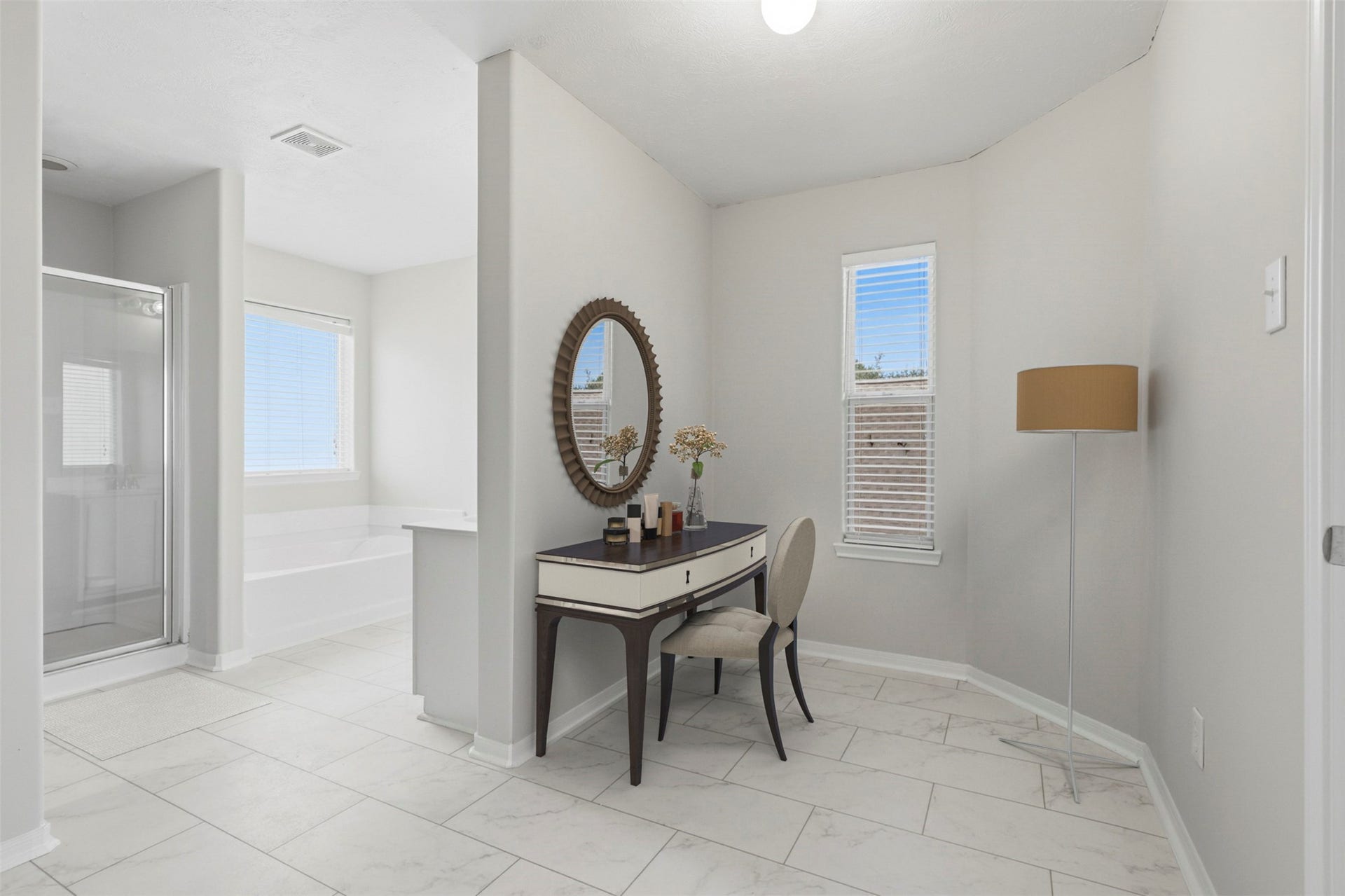 Virtually staged to showcase one of the many possibilities for this space in the primary bathroom, illustrated here as a vanity area.