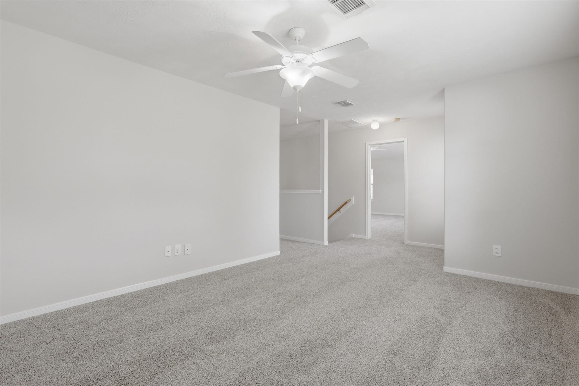 Spacious gameroom on the 2nd floor featuring fresh paint and brand new carpetready for your personal touch!