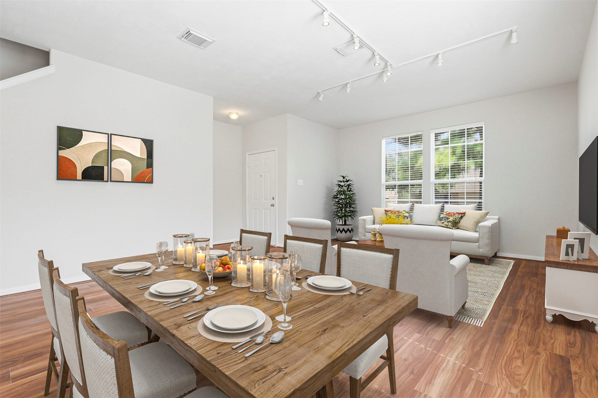 Virtually staged photo illustrating the potential layout of the spacious open-concept formal living and dining area.