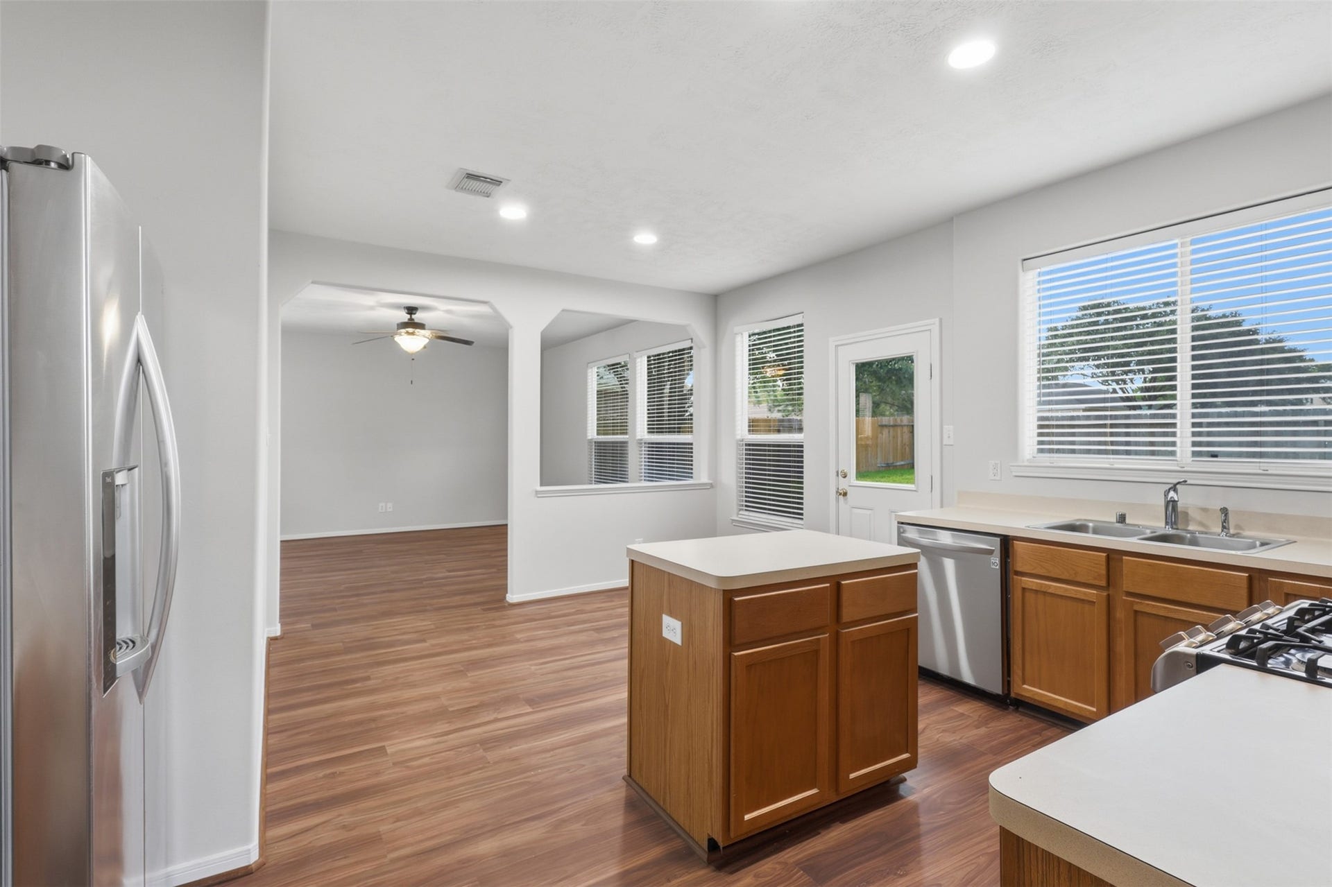 Kitchen view showcasing the center island with additional storage space, complemented by ample cabinetry and counter space.