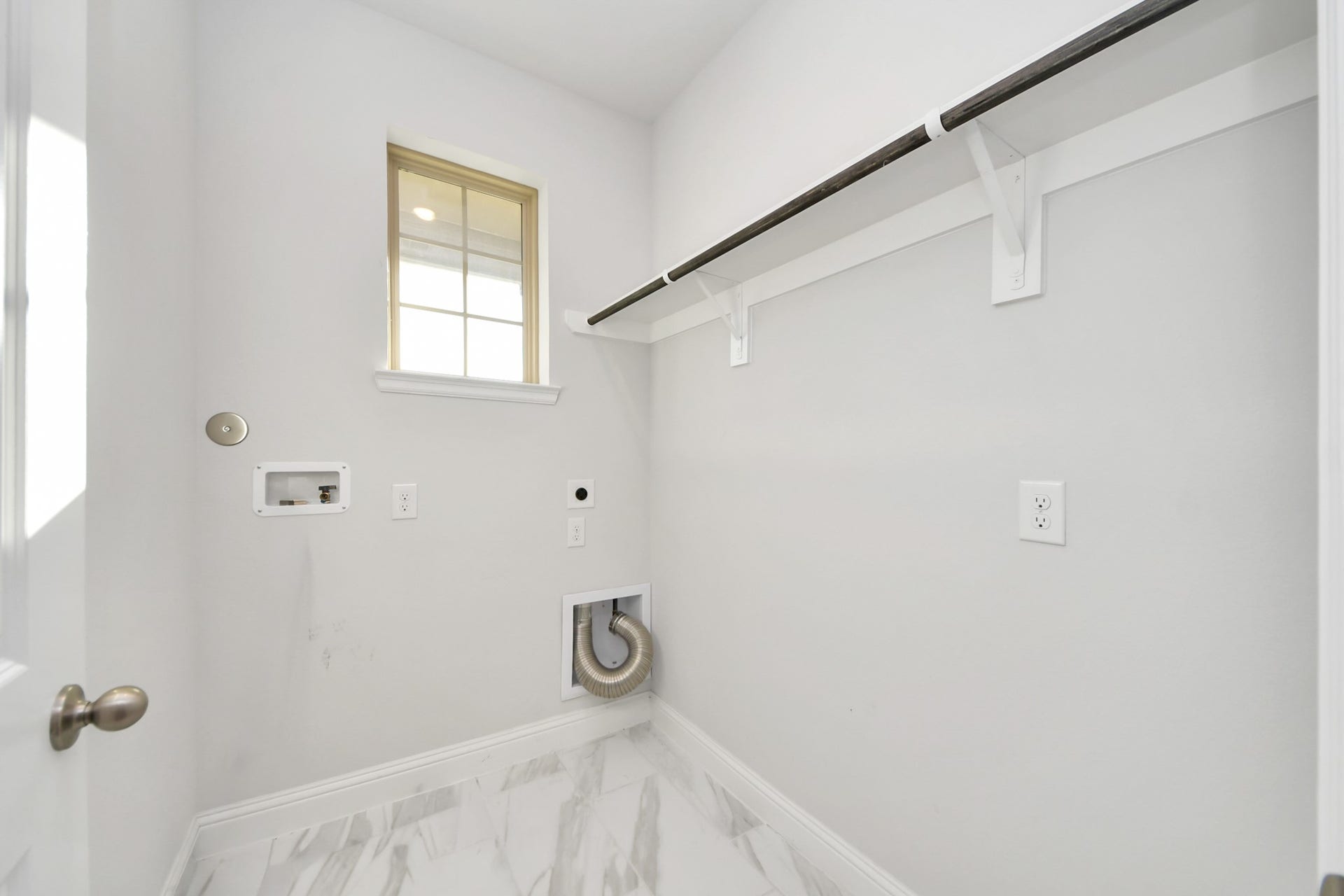 4251 Colony Lane, Missouri City, TX 77459 Laundry room just located near the entrance.