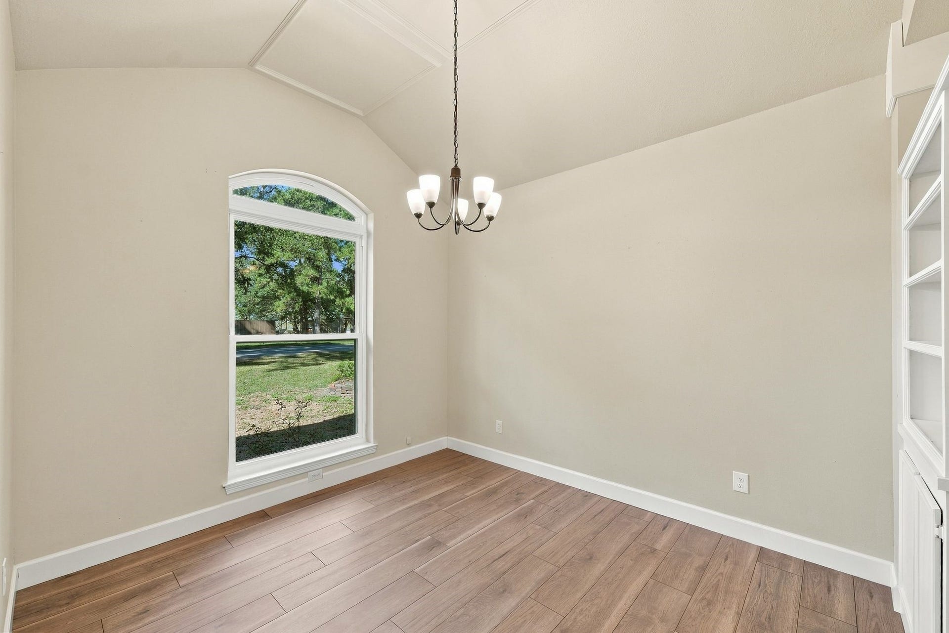 1065 Heritage Lane, Conroe, TX 77304 This home office with custom built ins has neutral paint, updated flooring, white trim and updated lighting.