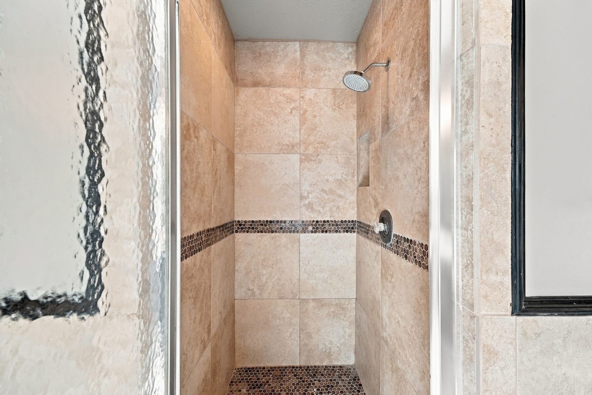 1065 Heritage Lane, Conroe, TX 77304 Updated tile stand alone shower with glass door in primary ensuite bath.