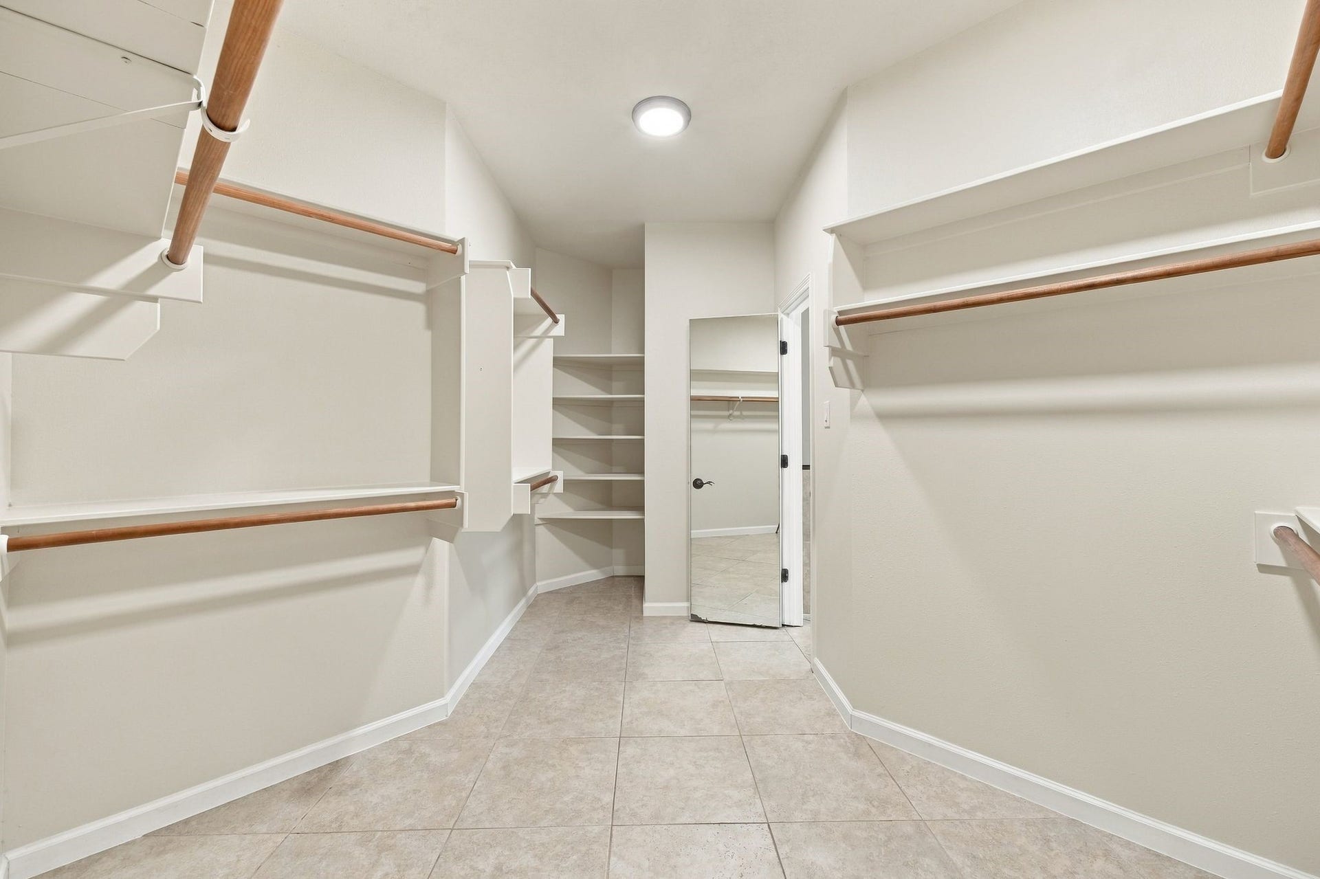 1065 Heritage Lane, Conroe, TX 77304 This primary walk in closet just keeps on going!