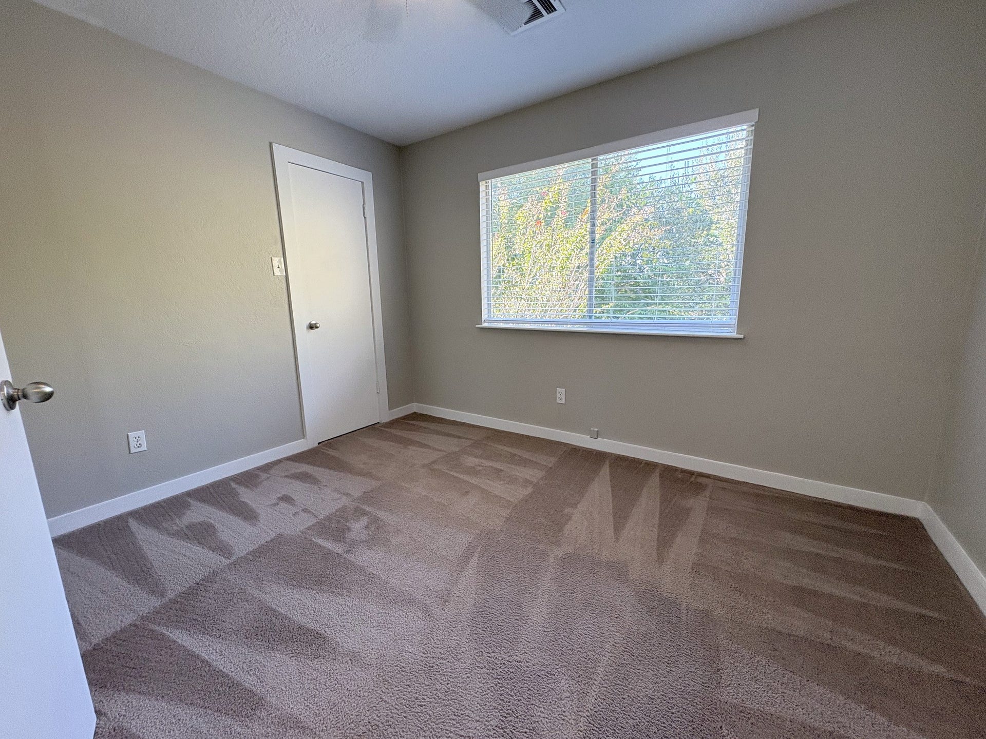 1015 Sugarfield Court, Sugar Land, TX 77498 Large double window overloking back yard illuminates Bedroom 3 as well