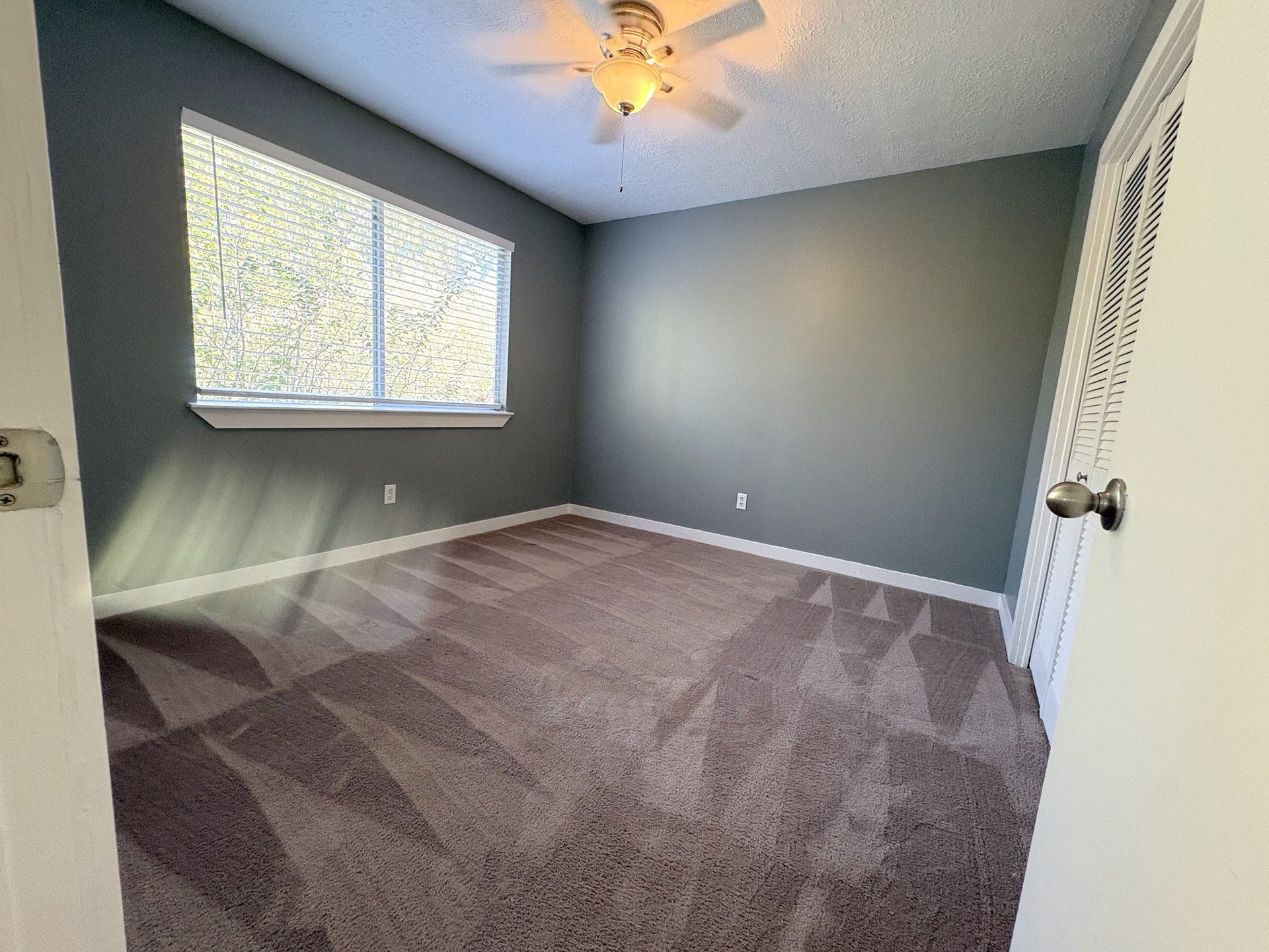 1015 Sugarfield Court, Sugar Land, TX 77498 Large double window overloking back yard illuminates Bedroom 2