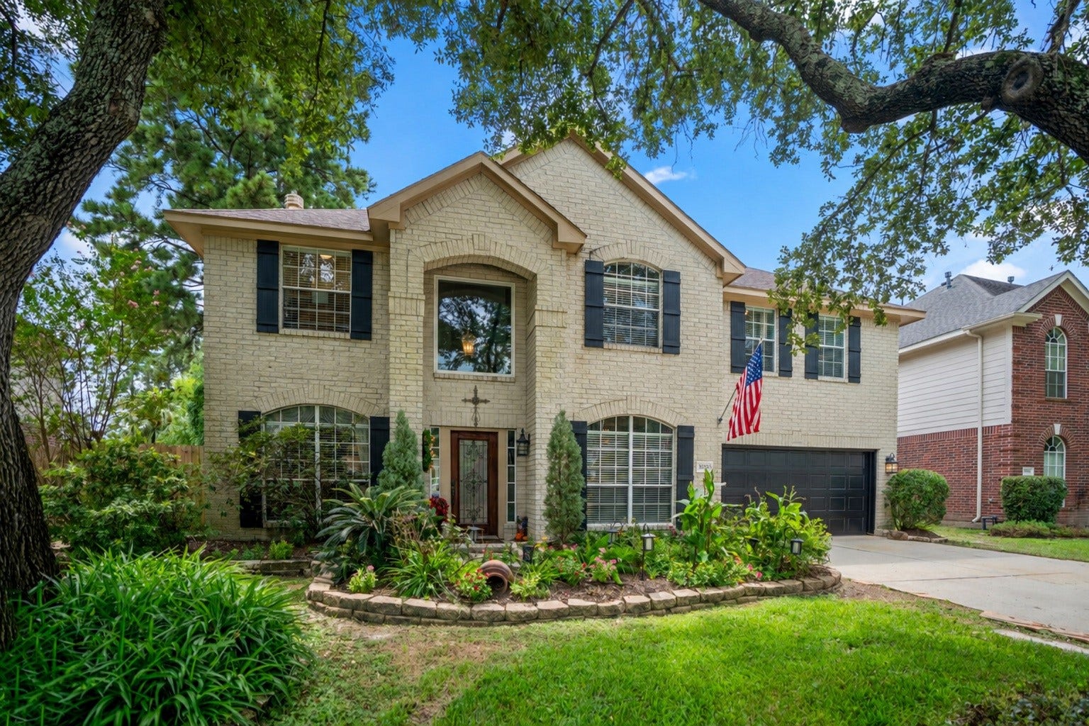 20235 Eden Pines, Spring, TX 77379 Welcome home to 20235 Eden Pines in the golf course community of Windrose. Mature trees and established landscaping frame the front approach, with a walkway leading directly to the entry.