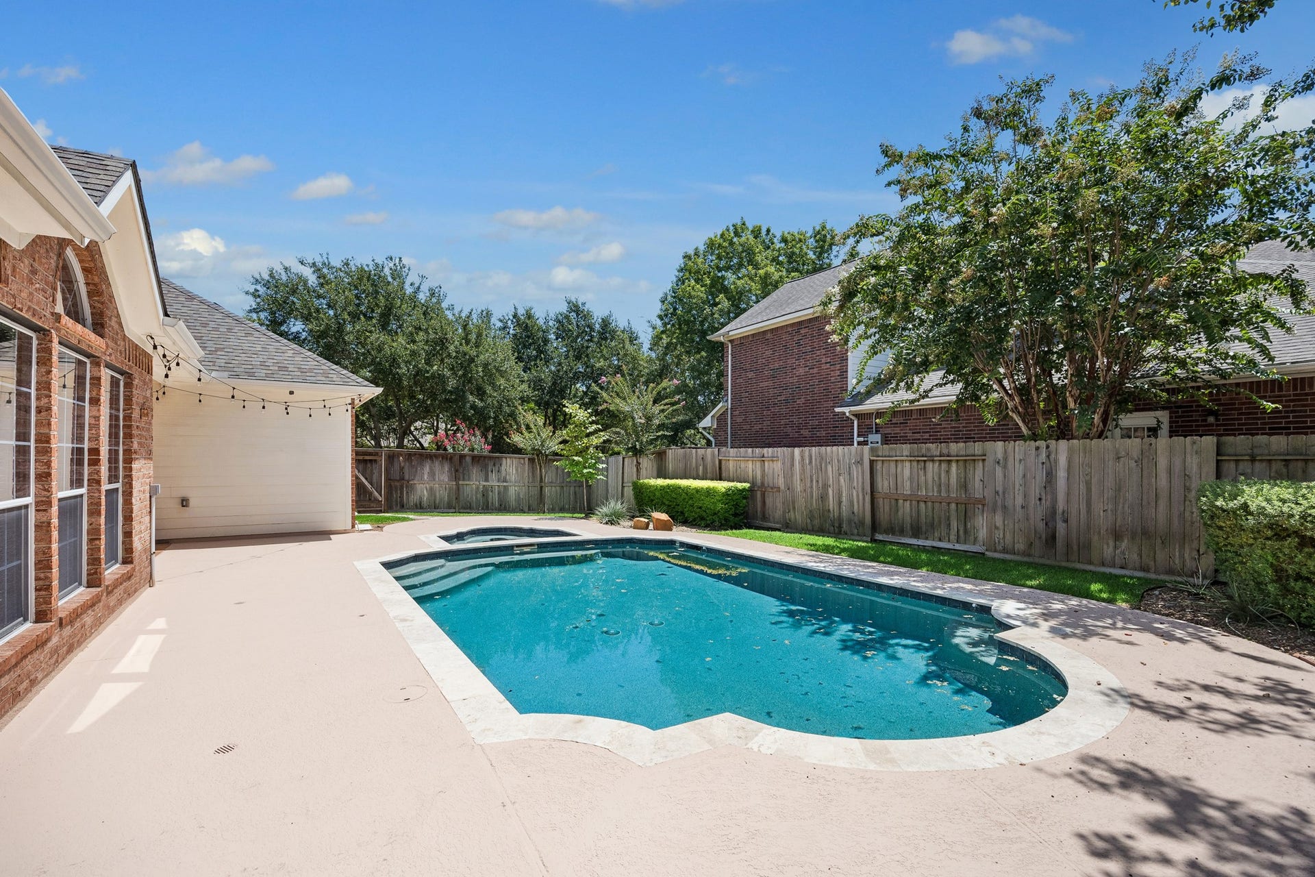 Your own private backyard retreat! Enjoy the beautifully updated pool featuring PebbleTec, new coping, travertine border, and heat-resistant paint, surrounded by mature landscaping with plenty of space to relax, entertain, and enjoy Texas summers.