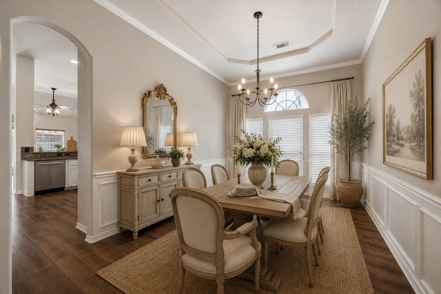 Virtually staged formal dining room showcases a spacious setting for hosting family and friends, featuring engineered hardwood flooring, updated lighting, elegant architectural details, and convenient access to the kitchen.