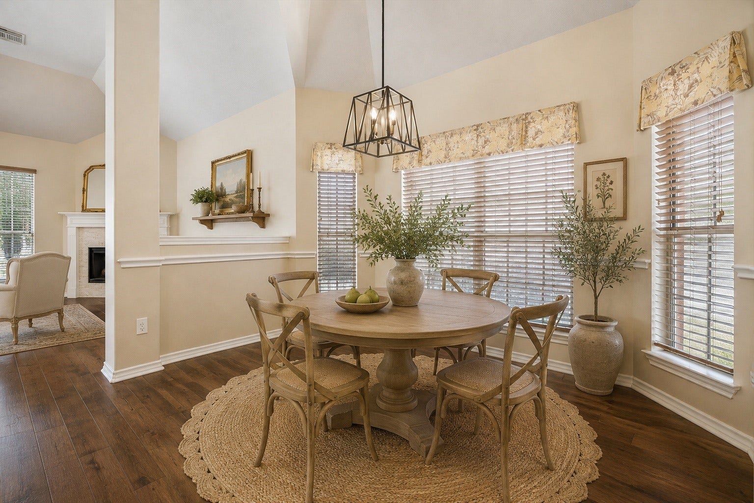 Virtually staged to showcase the possibilities, the light-filled breakfast room offers a charming space for casual dining with large windows, updated lighting, and convenient access to the kitchen and main living areas.