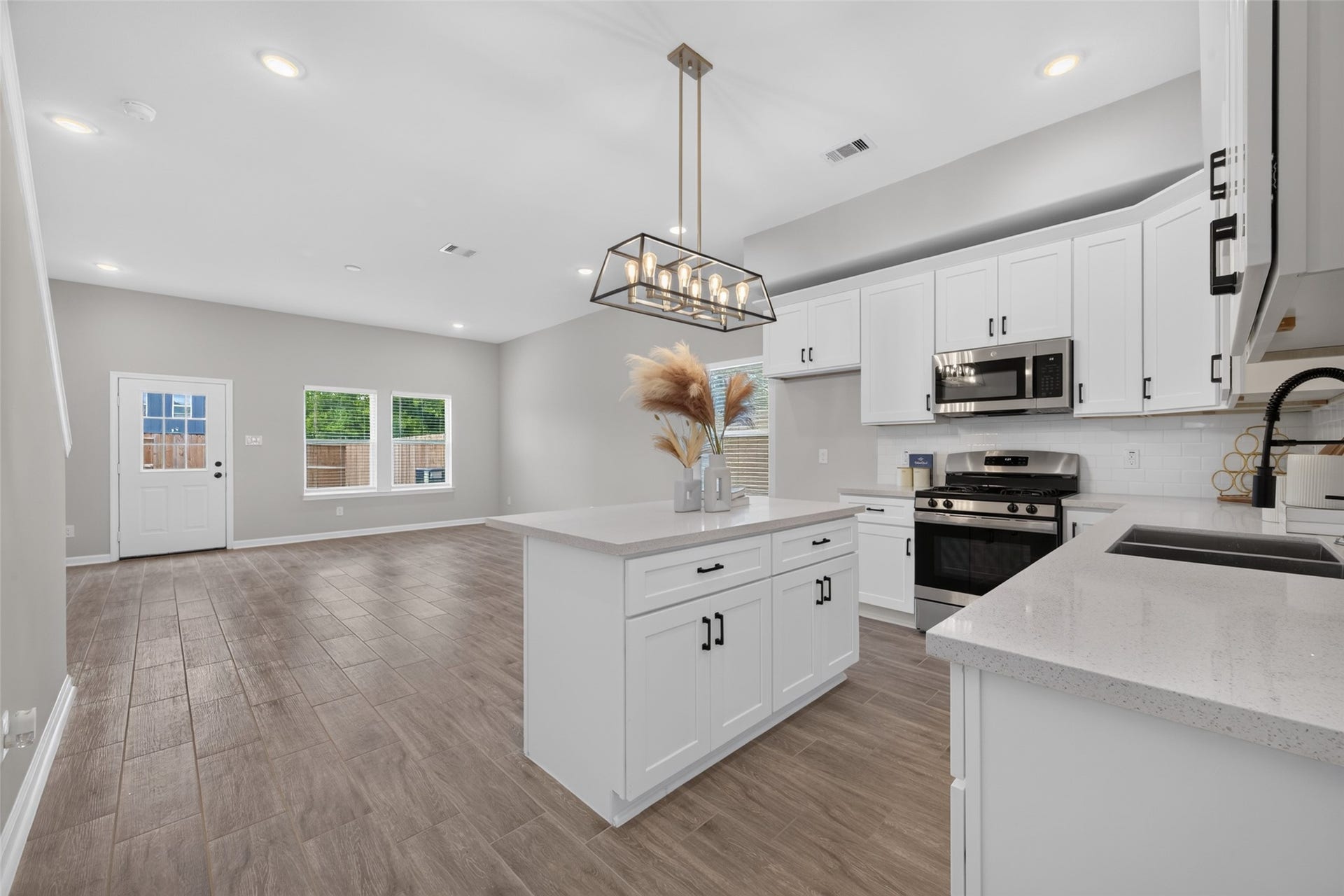 5915 Haight Street, #A, Houston, TX 77028 Awesome modern layout on the first floor puts the spacious living room open to the dining area and kitchen.