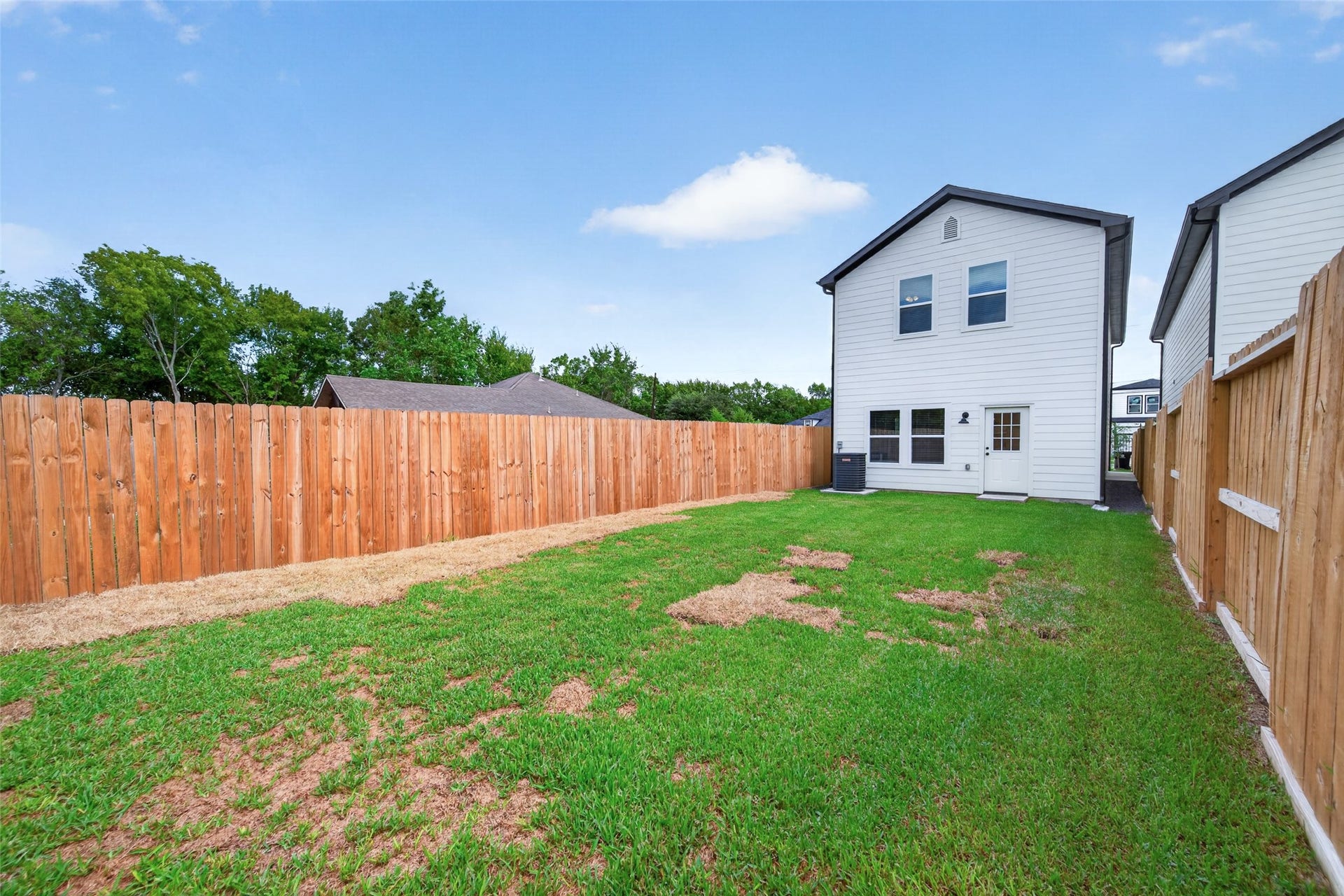 5915 Haight Street, #A, Houston, TX 77028 Spacious backyard with privacy fencing, perfect for outdoor activities and entertaining.