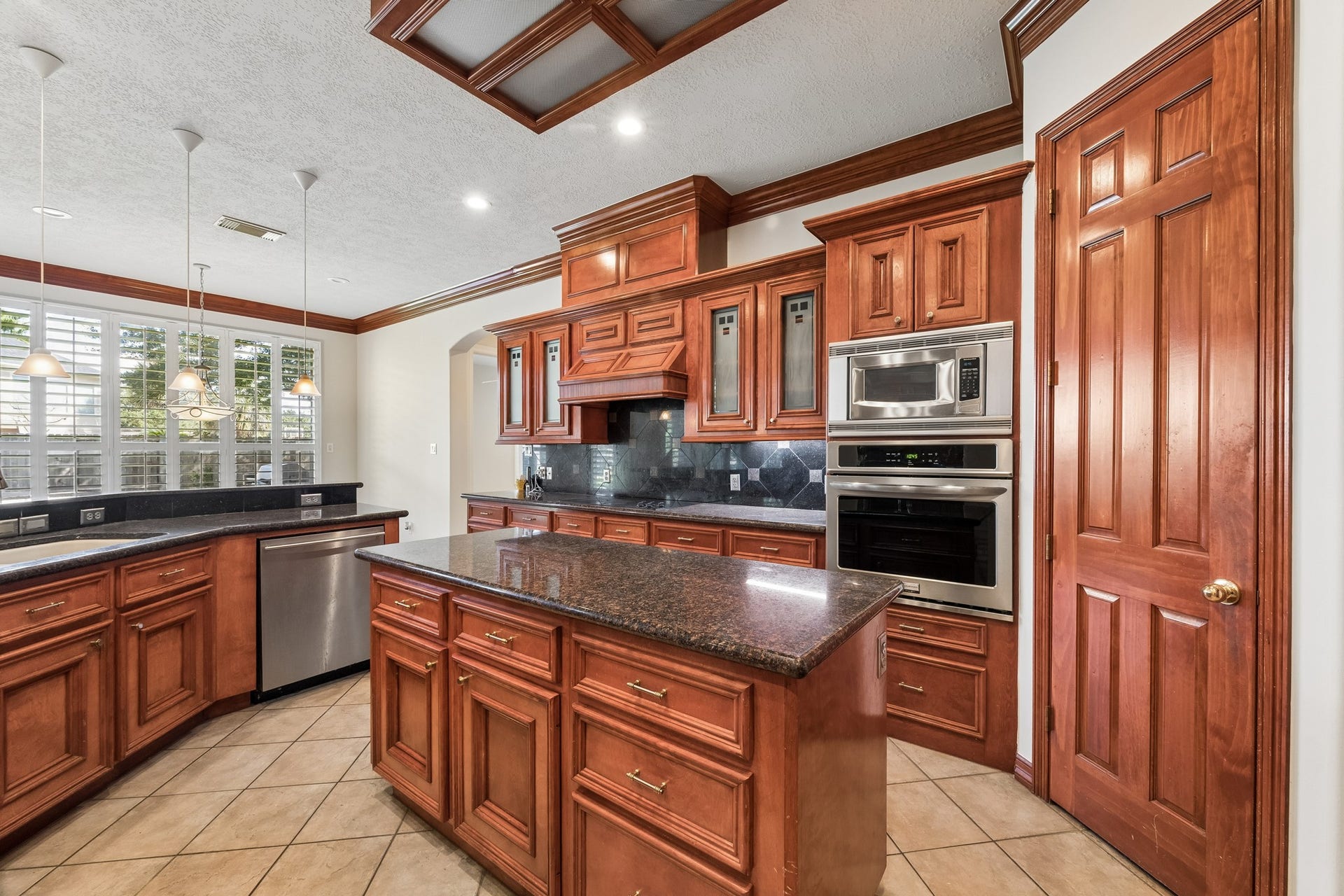 2731 Lakecrest Drive, Pearland, TX 77584 Custom cabinetry in the island kitchen with recently replaced oven.