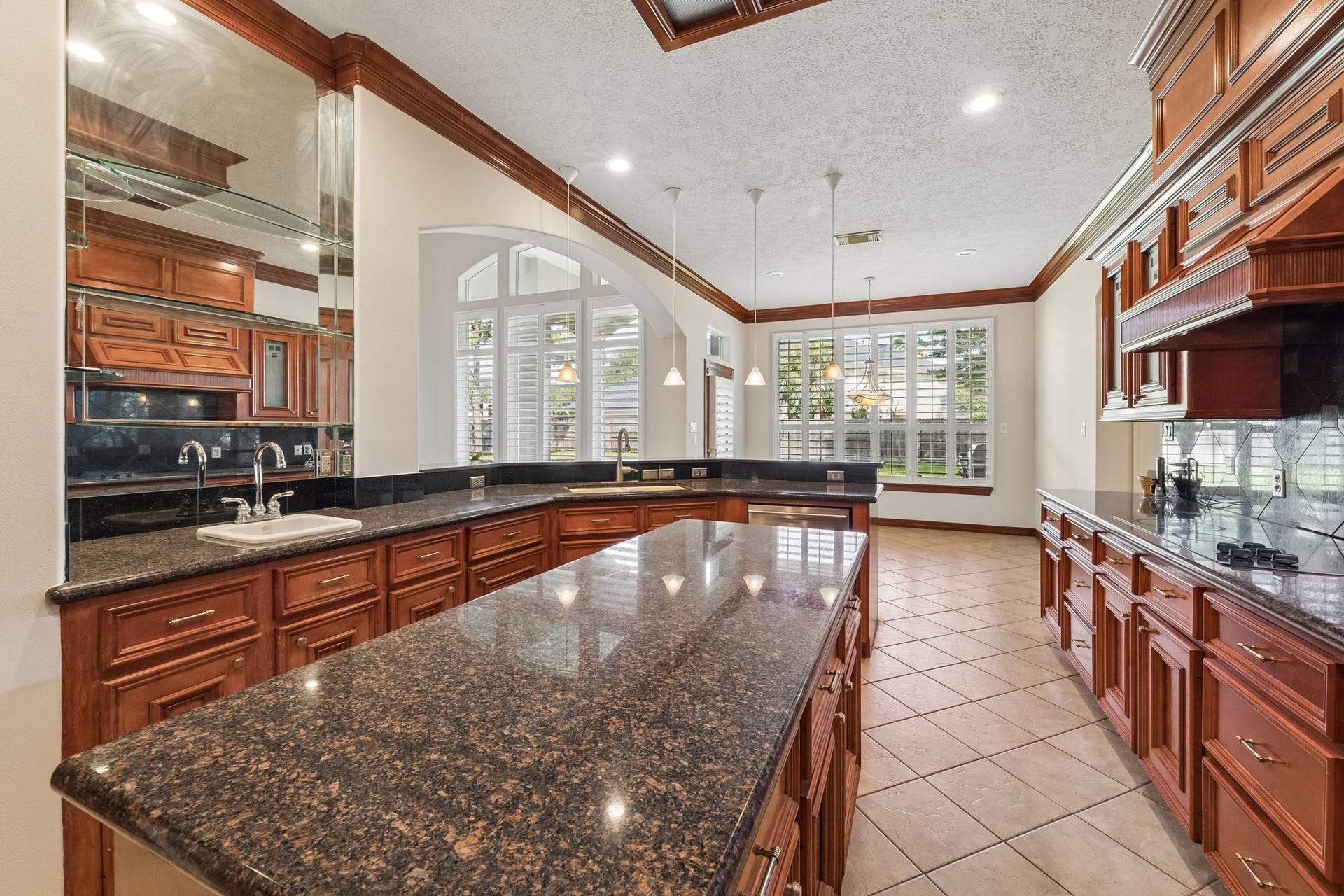 2731 Lakecrest Drive, Pearland, TX 77584 Notice the glass butler's bar with private sink off the kitchen.
