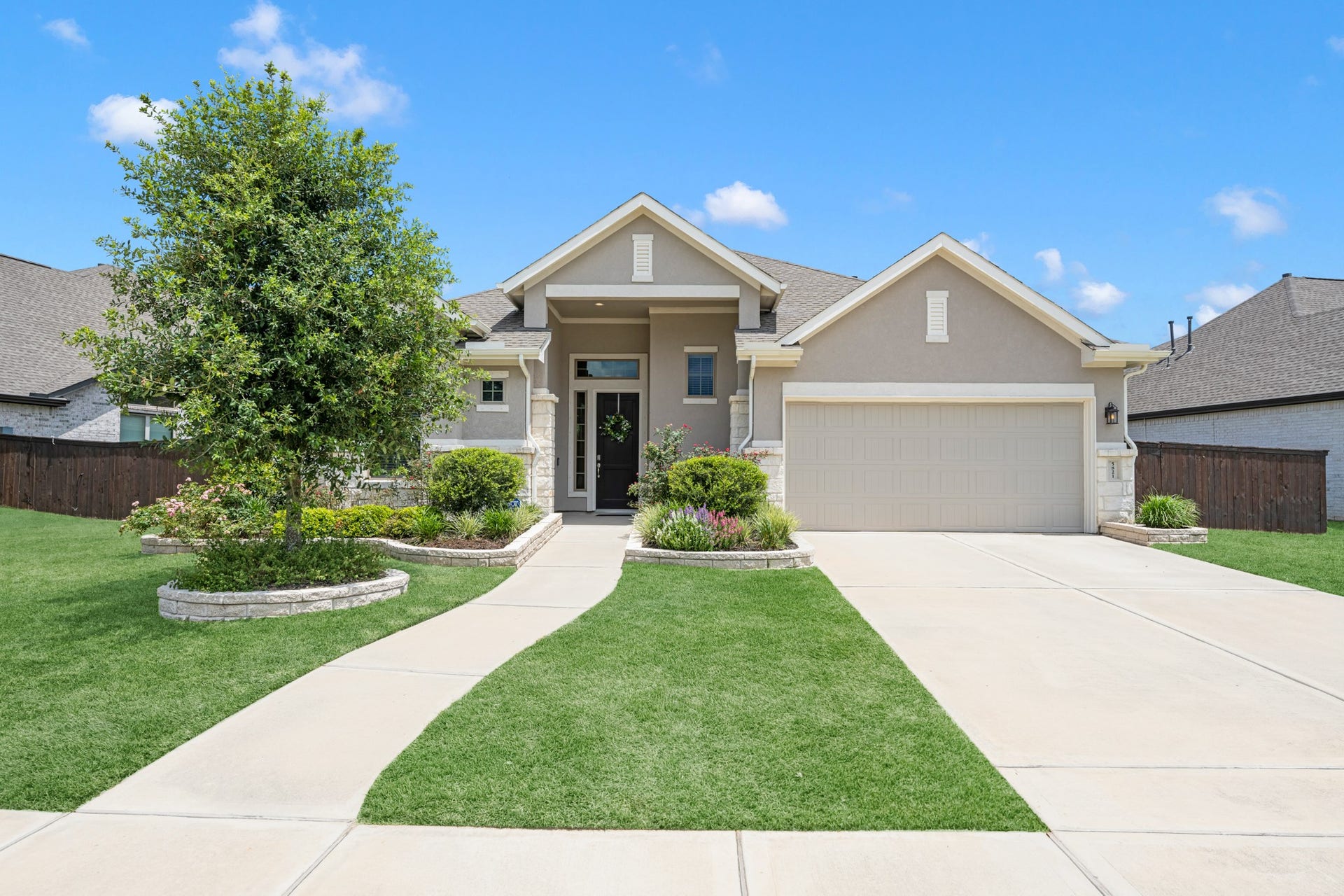 5821 Lavaca Lane, Manvel, TX 77578 Front exterior of the home, beautiful lawn with 2 car garage