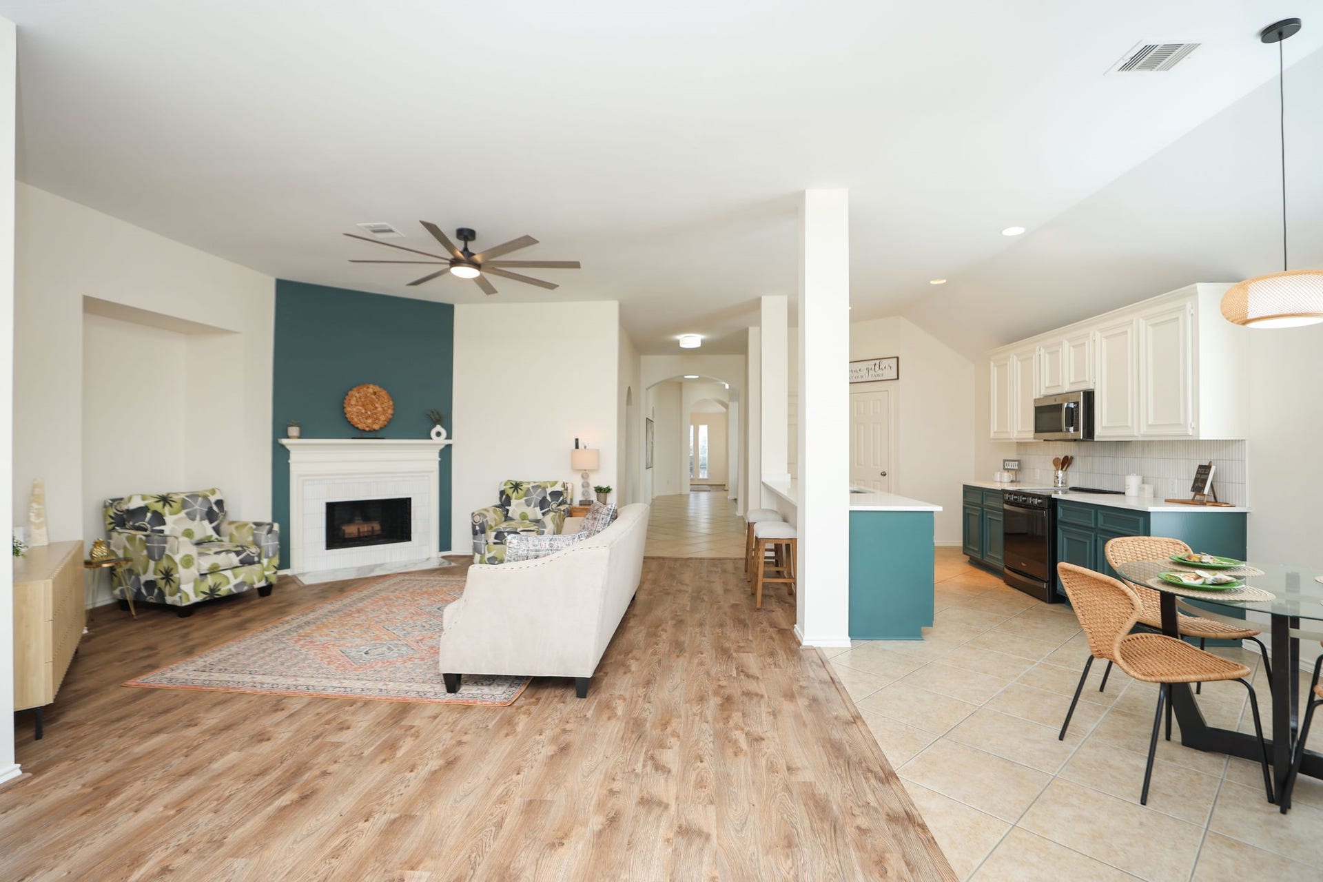 4814 Mosaic Canyon Court, Humble, TX 77396 View from the back door showcasing the open kitchen and dining area with grand central hallway back to the front door!