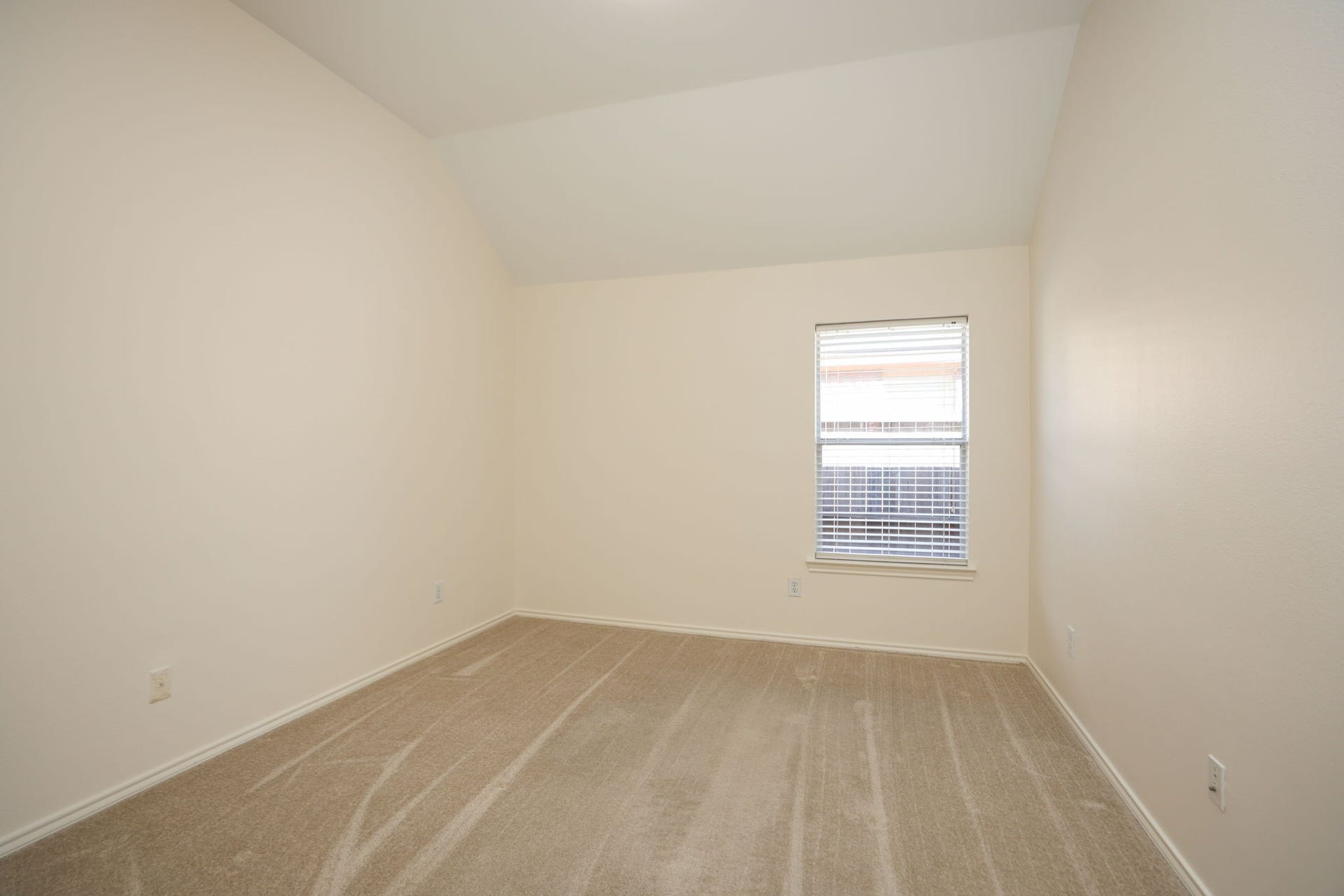 4814 Mosaic Canyon Court, Humble, TX 77396 2nd bedroom in this split floor plan home feels very spacious with high ceilings and fresh paint in whole home!