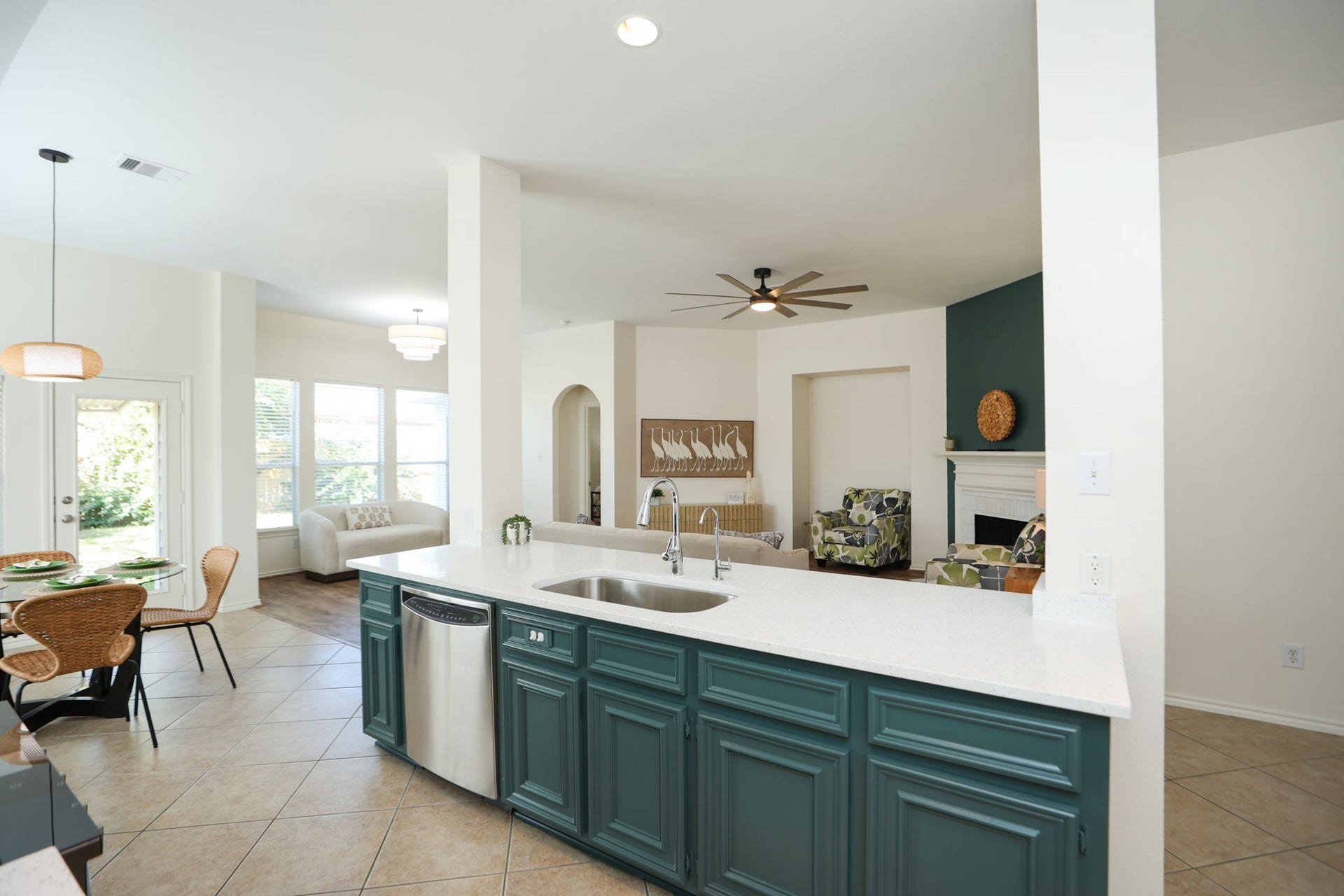 4814 Mosaic Canyon Court, Humble, TX 77396 Home is accented with "Hidden Gem", the "color of the year" with an otherwise light palette to suite any decor.