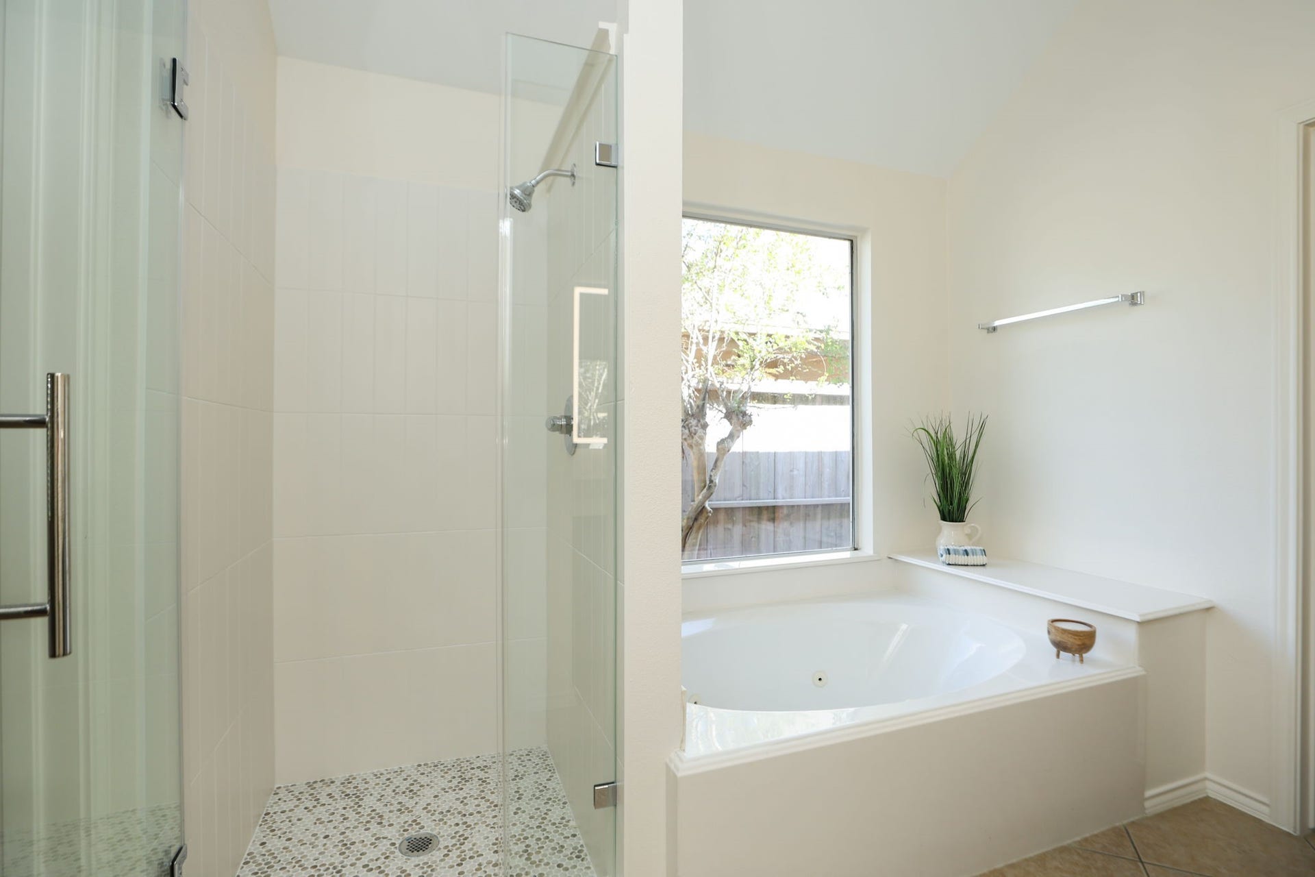 4814 Mosaic Canyon Court, Humble, TX 77396 Fabulous primary bath has a brand new shower with seamless glass entry and penny tile floor! Soaking tub for nights in.