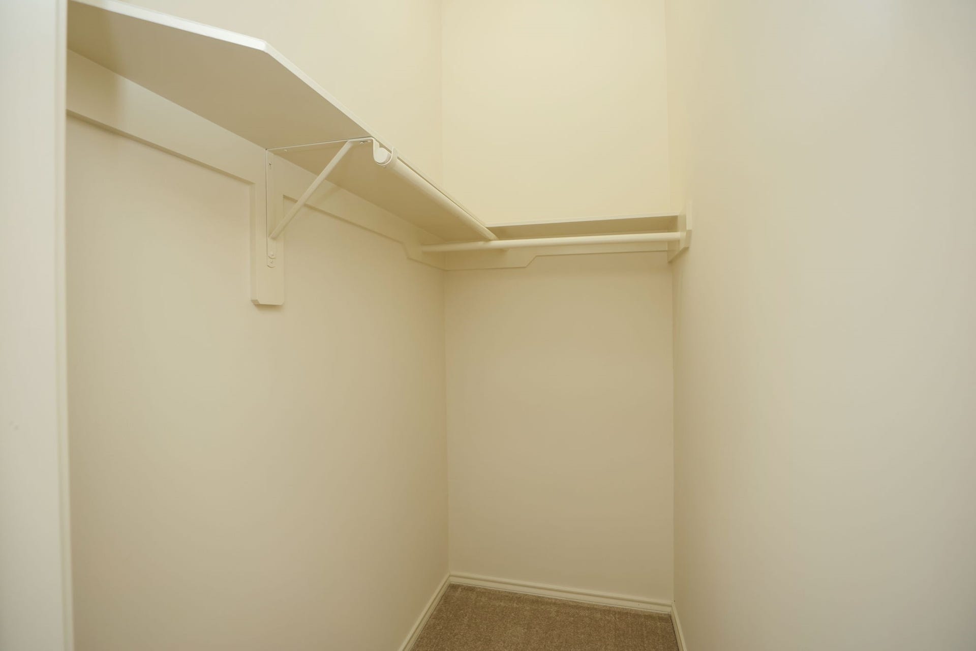 4814 Mosaic Canyon Court, Humble, TX 77396 Hallway to the other bedrooms includes this bonus walk-in closet for sports gear, crafting, or additional storage.
