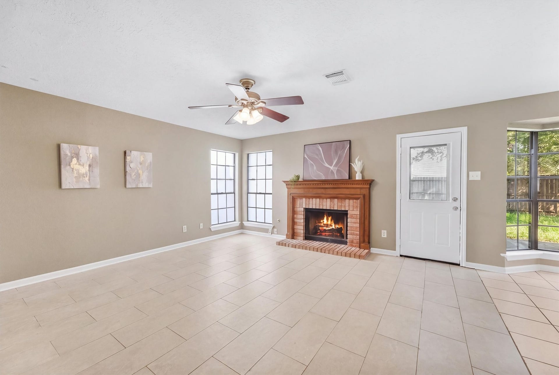 1926 Victoria Garden Drive, Richmond, TX 77406 Cozy living room fireplace perfect for gatherings