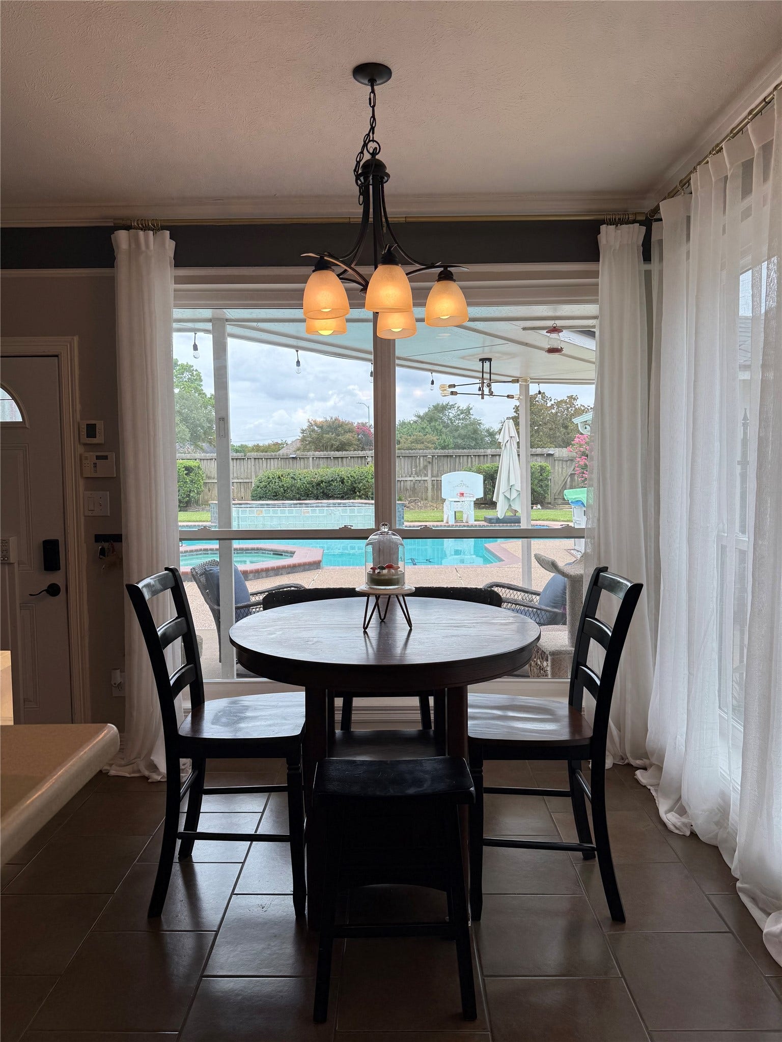 The breakfast nook overlooks the pool area