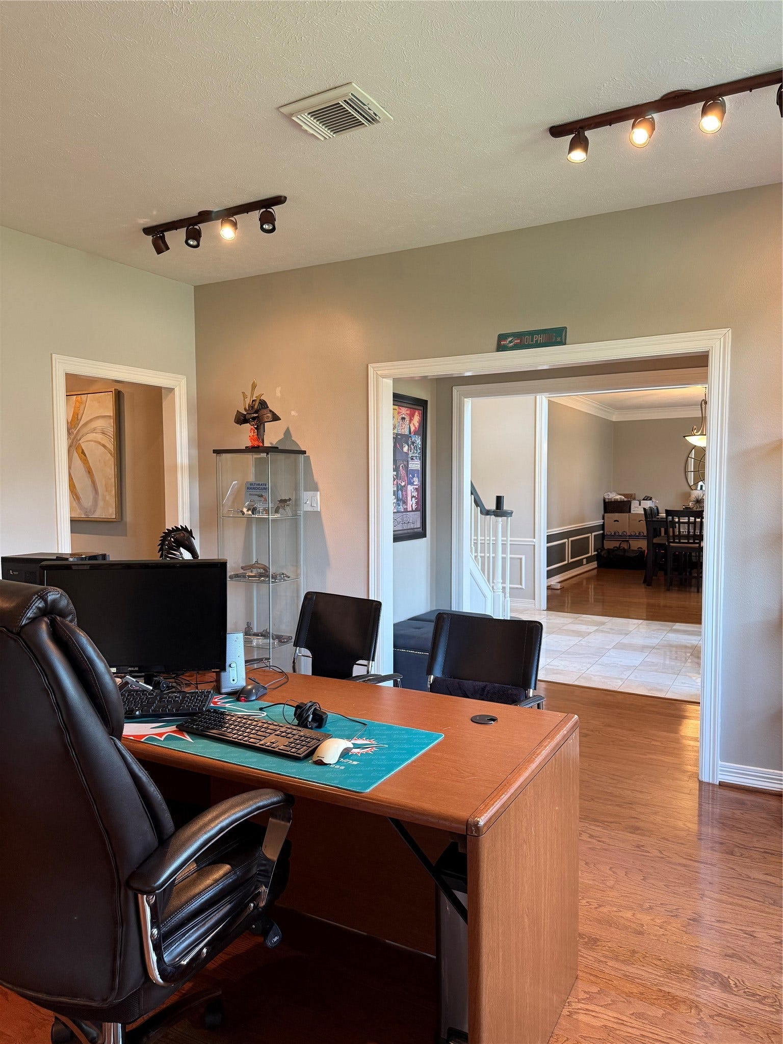 Seamlessly transition from a stylish home office into an elegant dining area, with convenient access to the half bathroom downstairs.