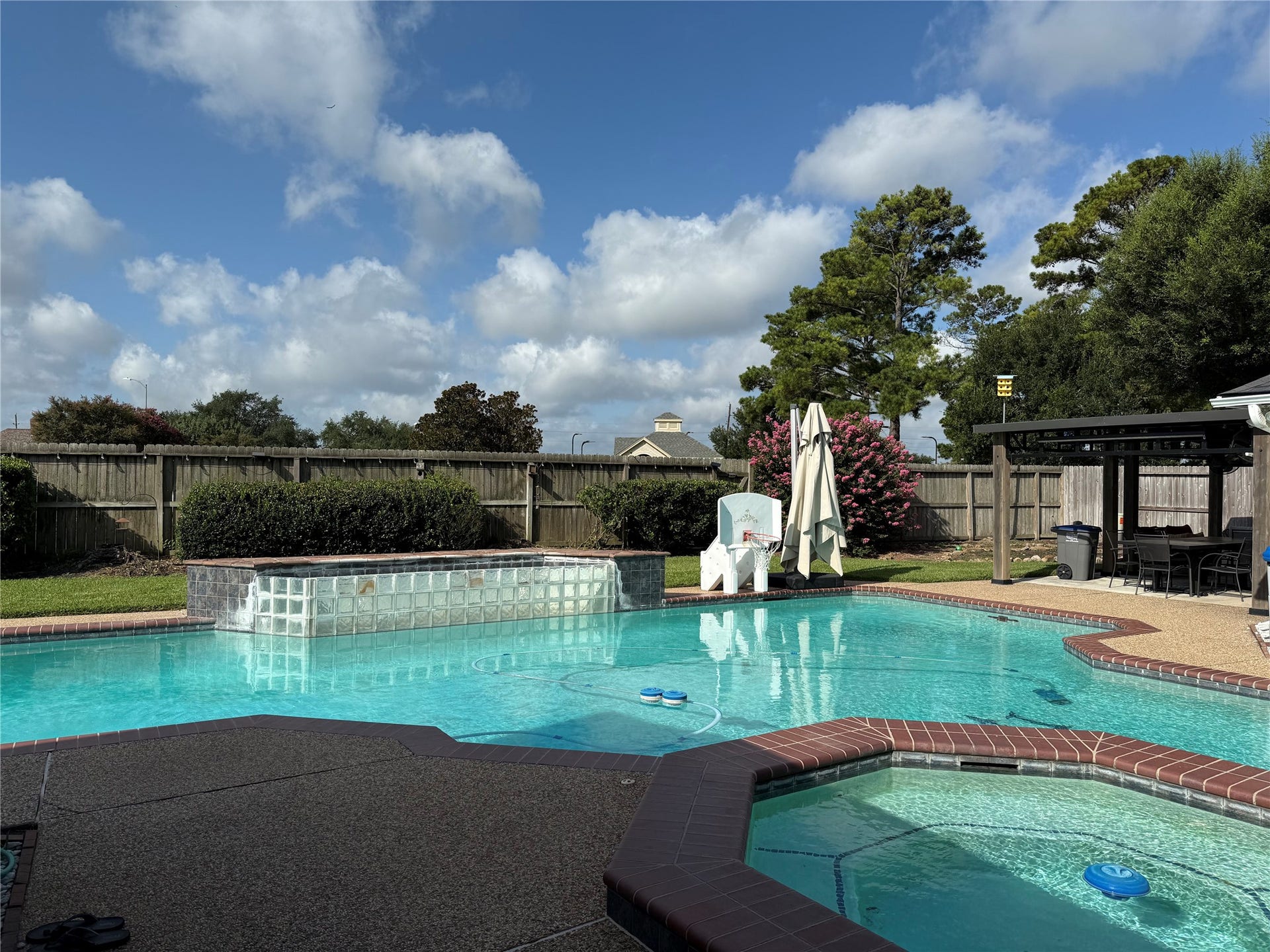 Enjoy seamless indoor-outdoor living with a stunning view of the swimming pool from the family room, perfect for relaxation and entertaining.