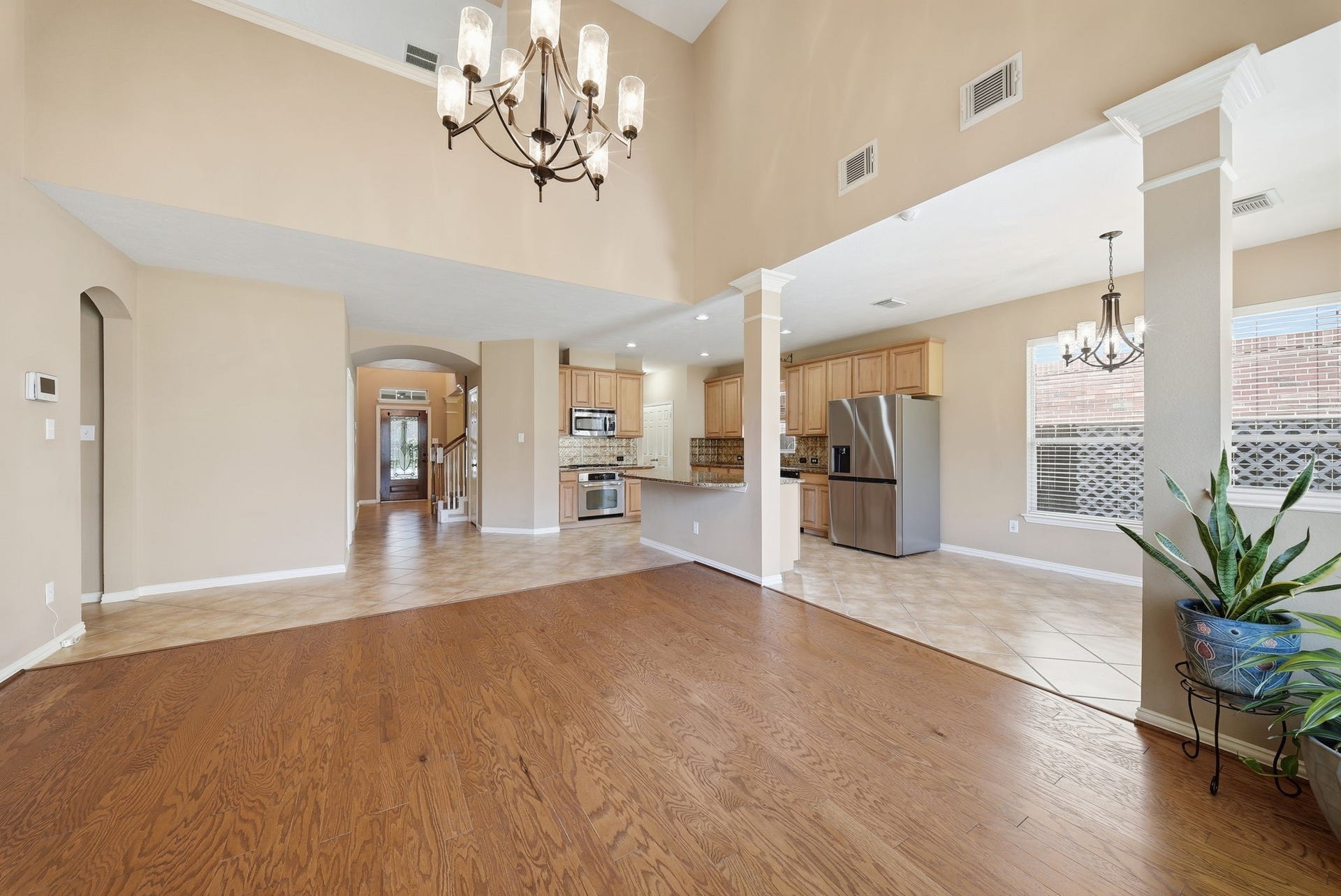 Enjoy an open, airy living area filled with natural light, with clear sightlines to the front door and foyer that create a welcoming flow throughout the home.